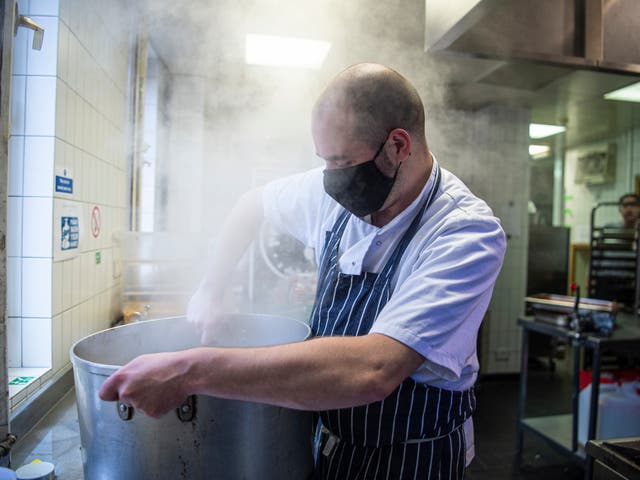 <p>Reporter Vincent Wood pictured during a day volunteering with the team delivering our Help The Hungry campaign</p>