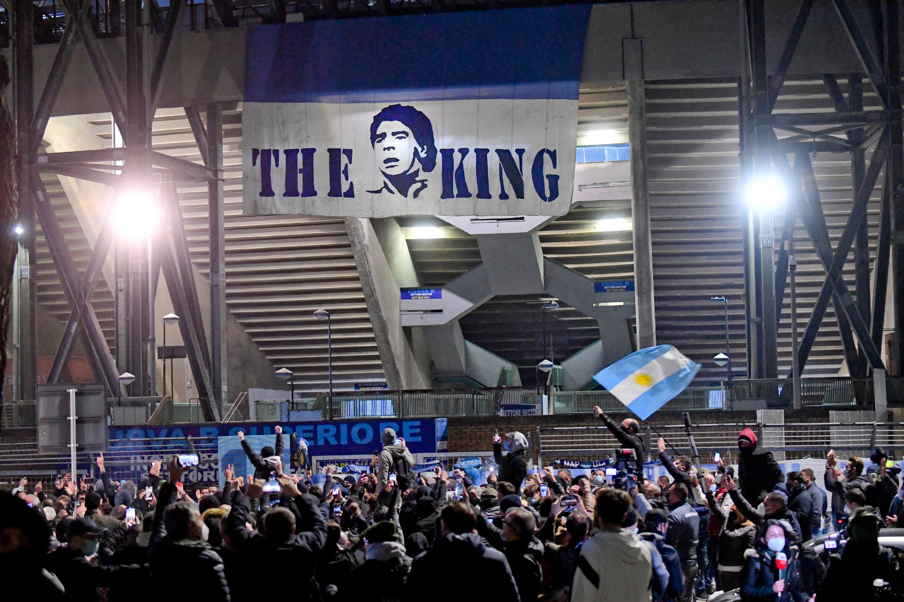 Fans gathered at the San Paolo stadium to pay tribute to Maradona in Naples