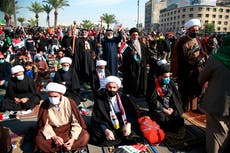 Demonstrators in Iraq take to street unmasked amid pandemic