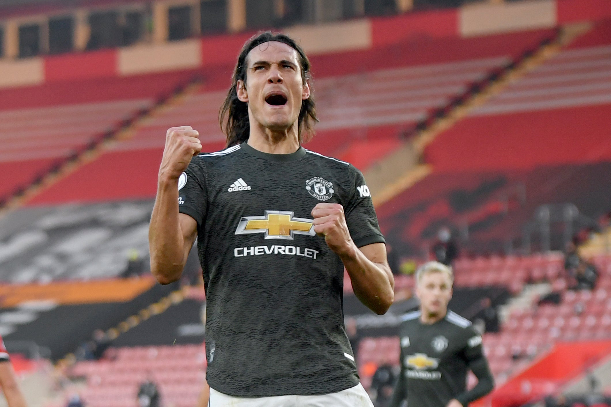 Edinson Cavani celebrates after scoring United’s third goal