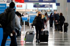 Holiday air travel surges despite dire health warnings 