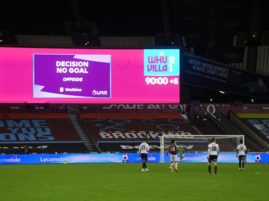 The big screen shows the VAR decision on Ollie Watkins’ goal