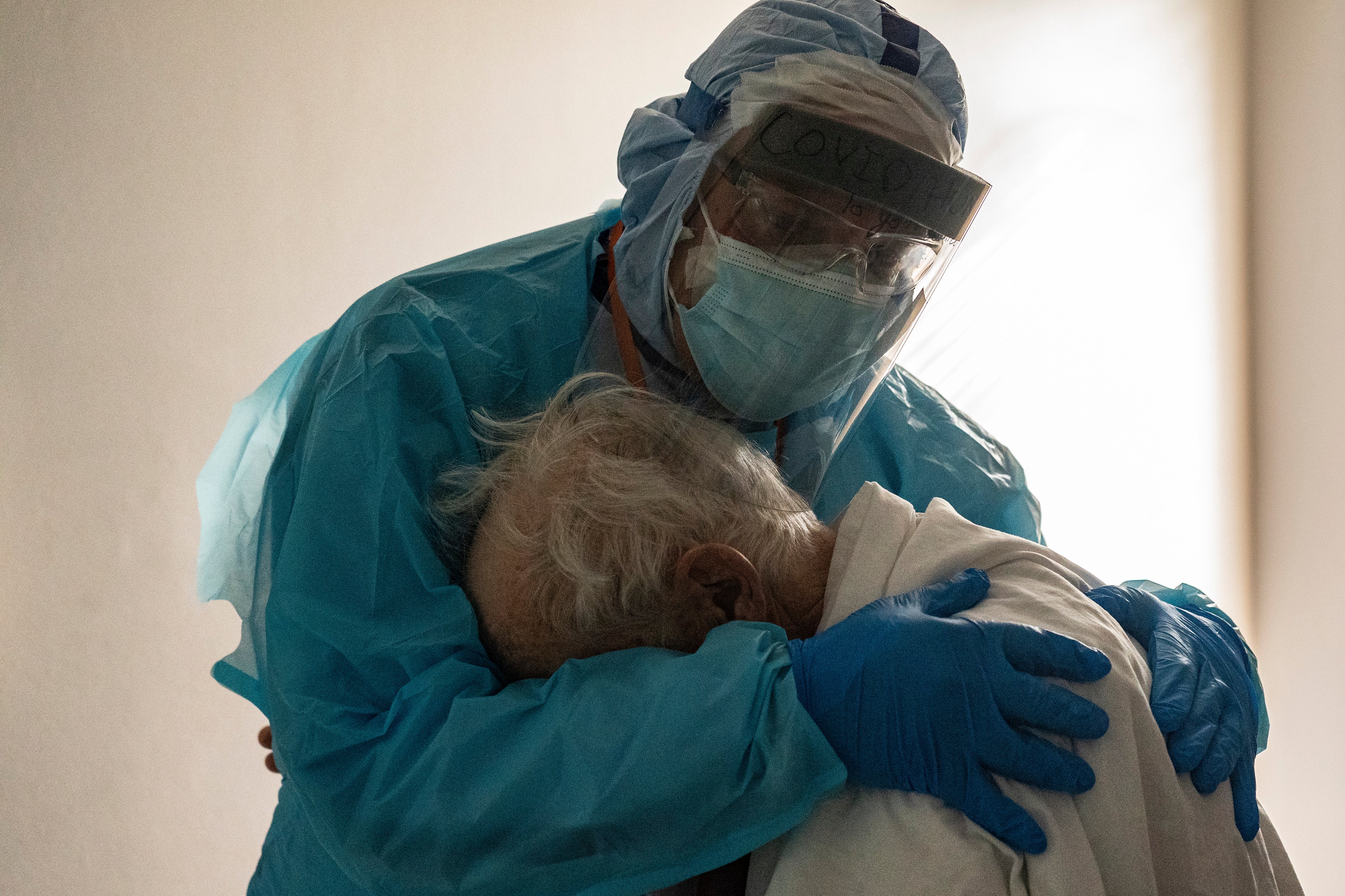 &nbsp;Dr Joseph Varon hugs and comforts a patient in the COVID-19 intensive care unit (ICU) during Thanksgiving at the United Memorial Medical Center