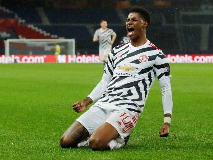 Manchester United striker Marcus Rashford scores against PSG