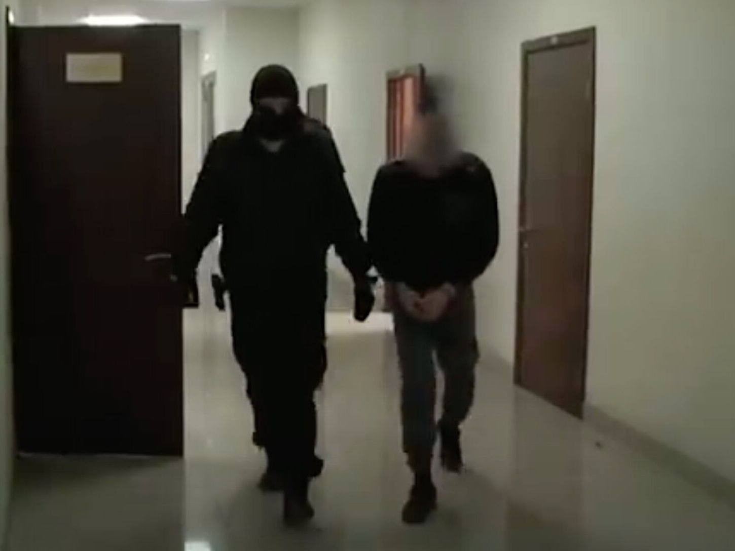 Radik Tagirov, who was arrested on suspicion of killing elderly women, is pictured in custody in Russia