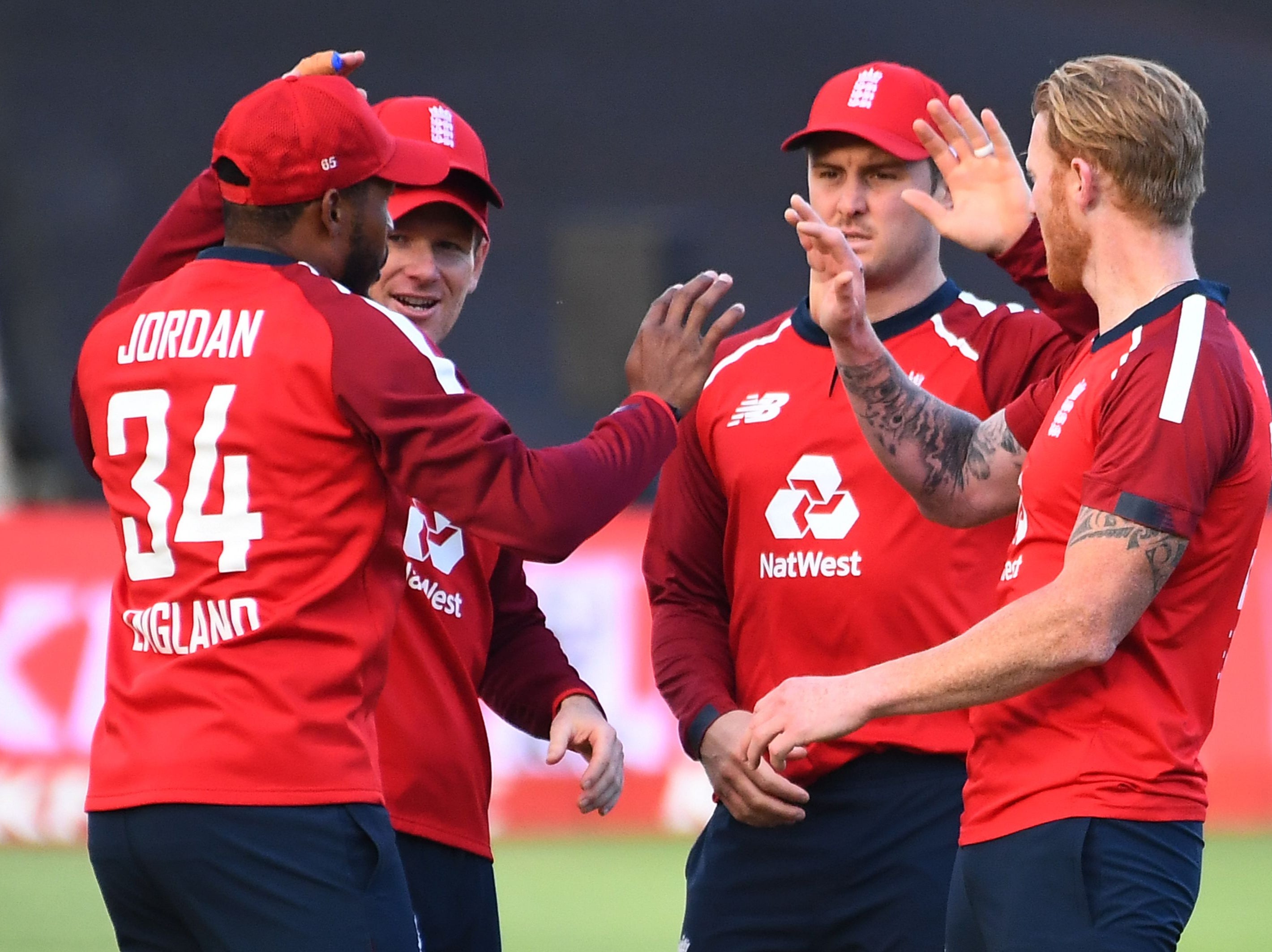 Chris Jordan celebrates with his England team-mates