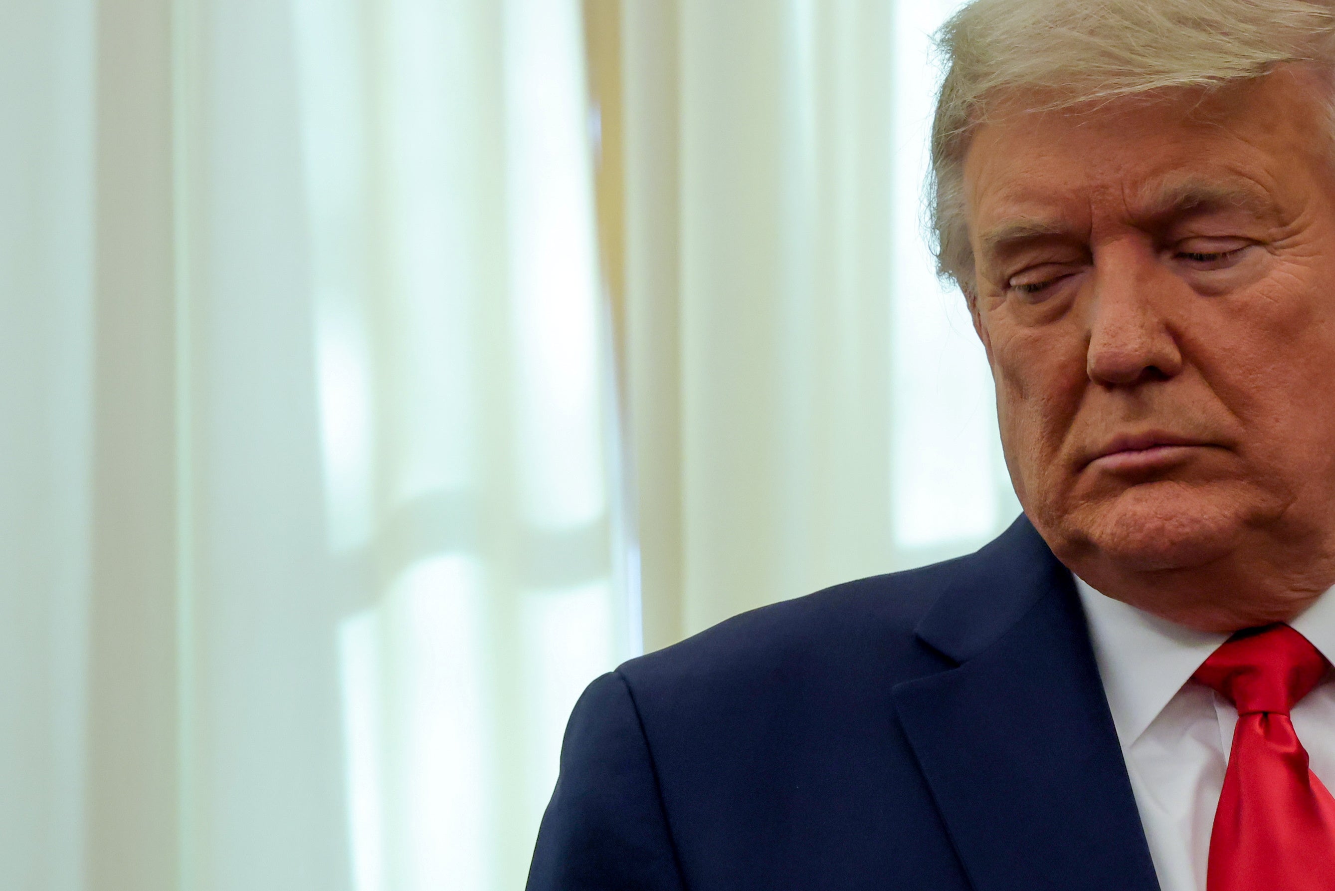 Trump participates in a medal ceremony in the Oval Office at the White House on 3 December.