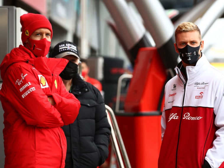 Mick Schumacher speaks to Sebastian Vettel