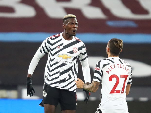 Paul Pogba of Manchester United celebrates with teammate Alex Telles at the weekend