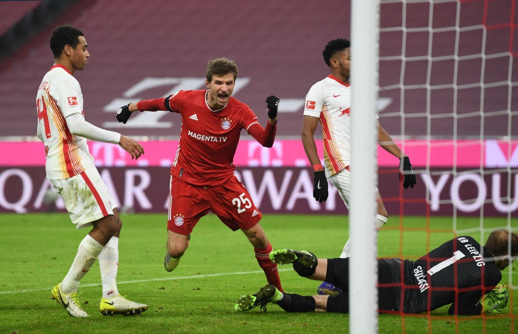 Bayern Munich's Kingsley Coman in action with RB Leipzig's Nordi Mukiele