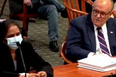 Giuliani asked a woman at the Michigan hearing to remove her mask