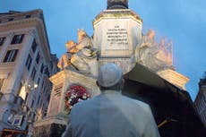 Pope makes surprise early morning prayer visit in rainy Rome