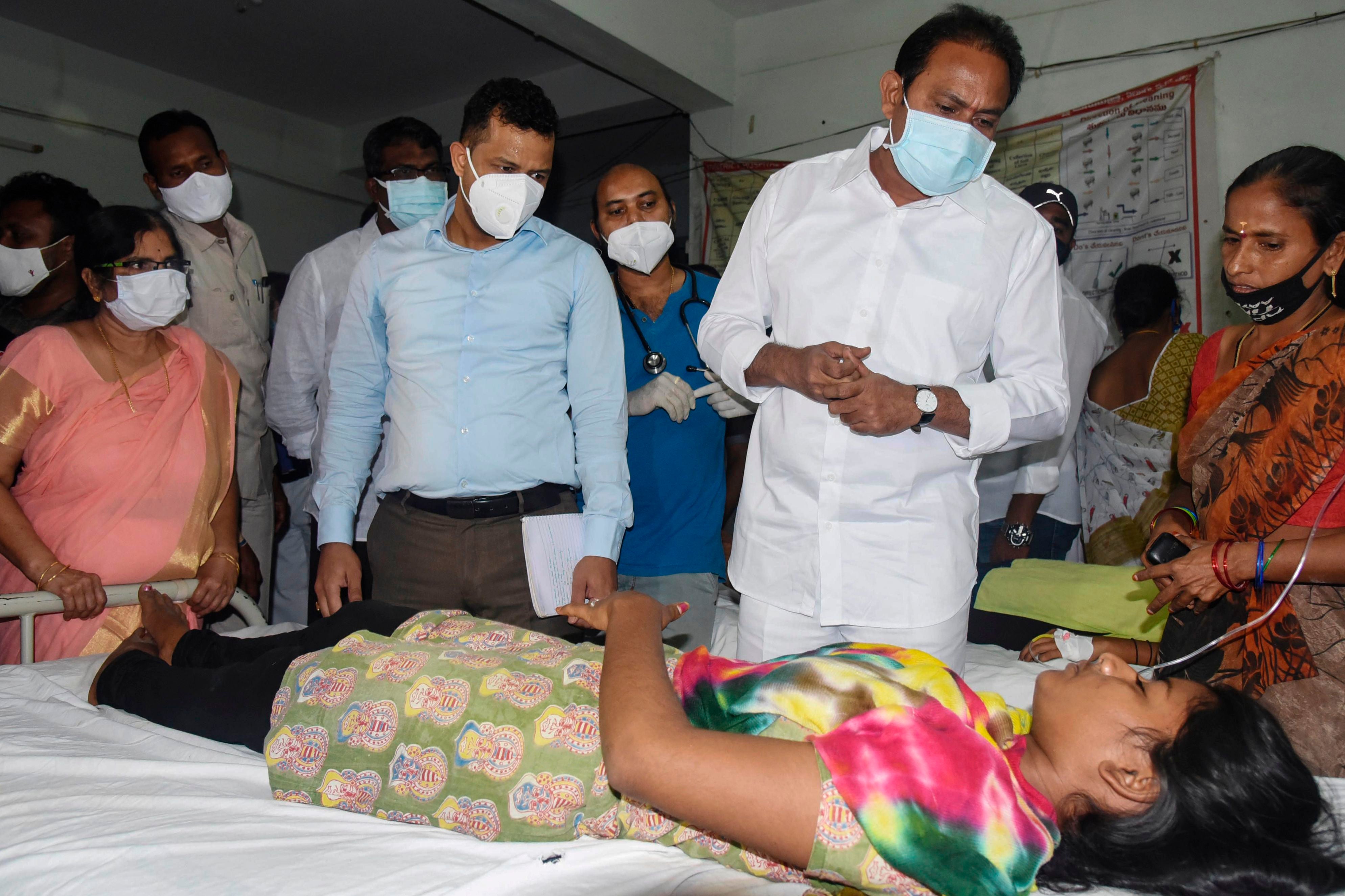 Andrha Pradesh Health minister Alla Nani visits patients receiving medical care for a mystery illness at a goverment hospital in Eluru