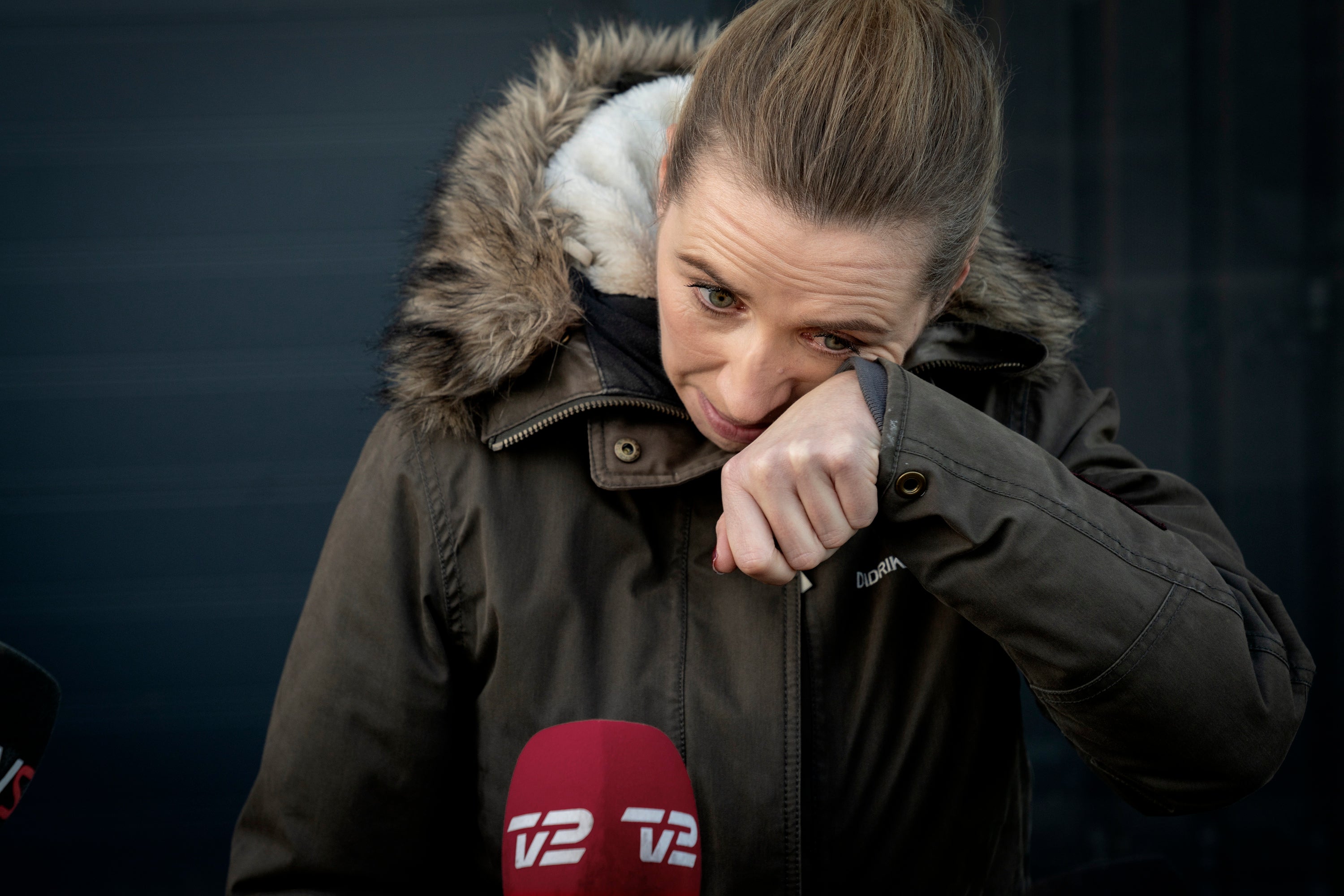 Denmark's Prime Minister Mette Frederiksen reacts after a visit to an empty mink farm