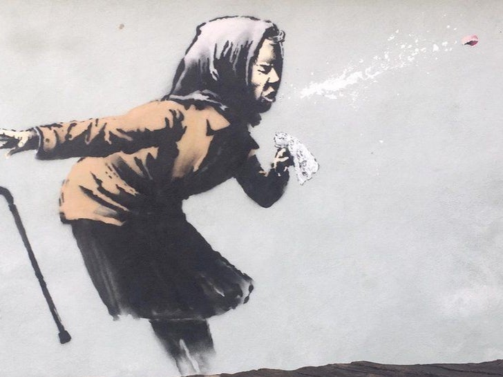 Graffiti of sneezing woman by Banksy appears in Bristol