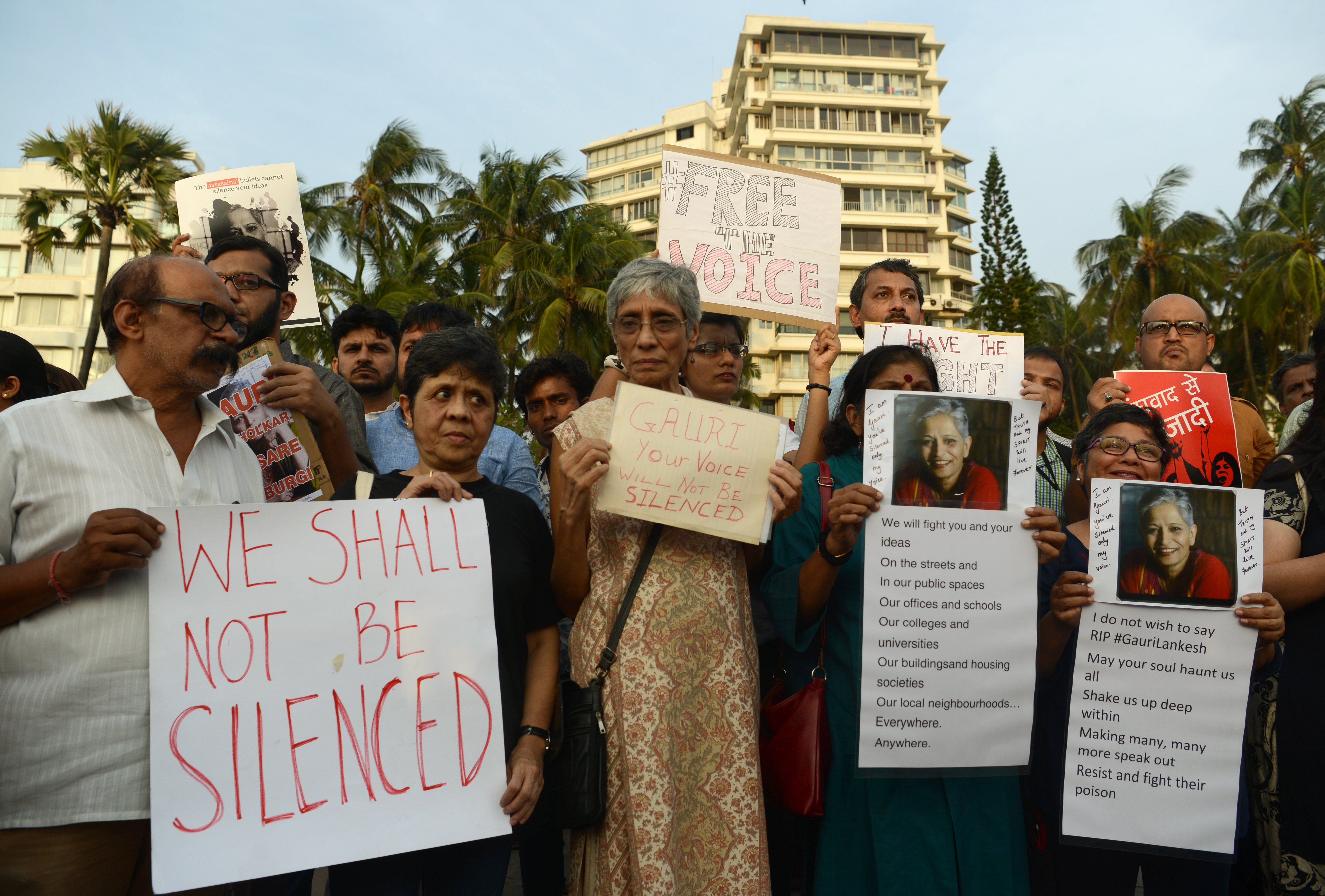 File Image: Indian protesters hold placards in a rally condemning the killing of journalist Gauri Lankesh, in Mumbai on September 6, 2017