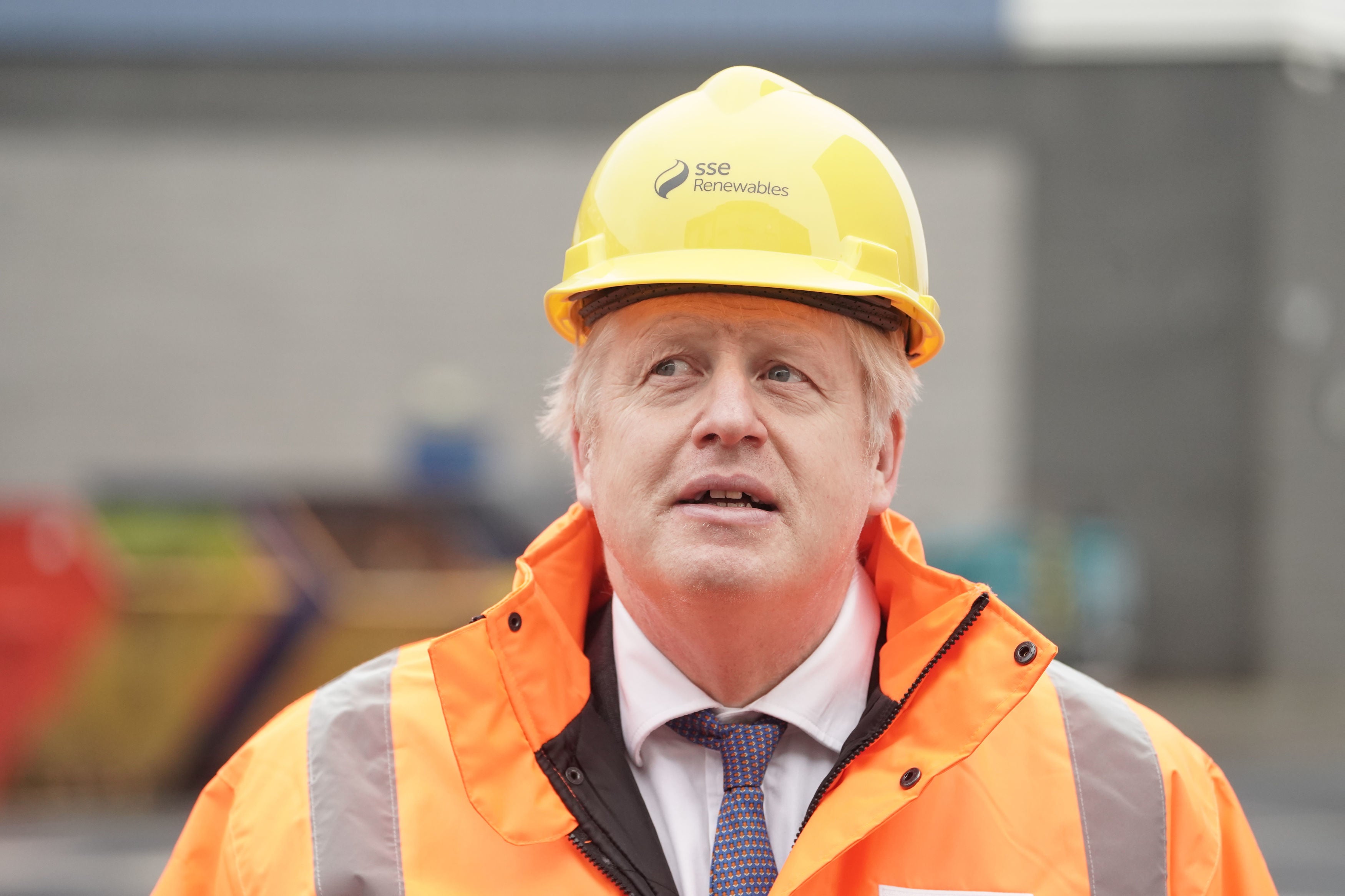 Boris Johnson visits the National Renewable Energy Centre in green clothes that are actually orange