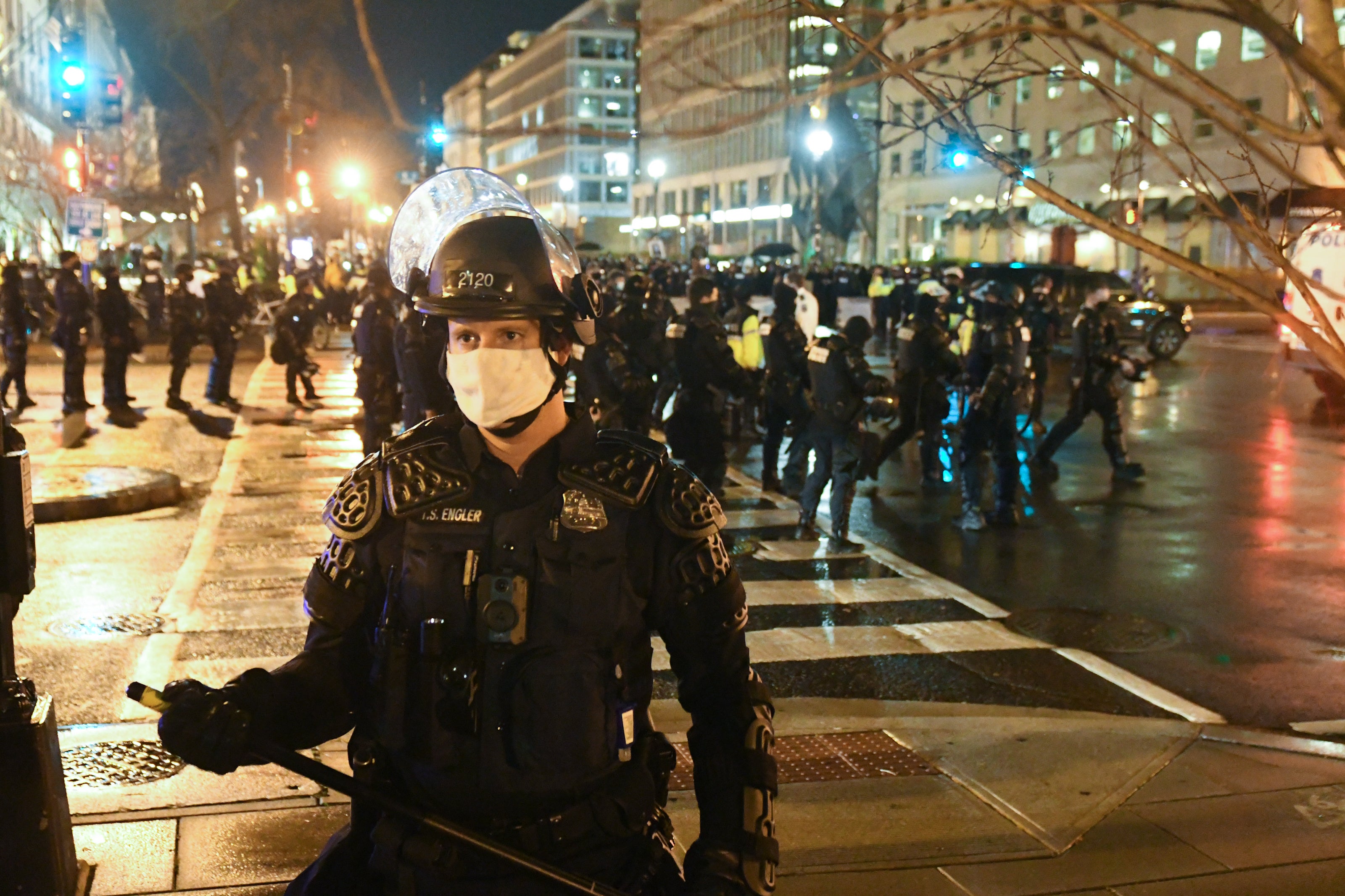 File image: A police officer in riot gear stands guard as protesters gather near Black Lives Matter Plaza during a protest on 12 December , 2020 in Washington