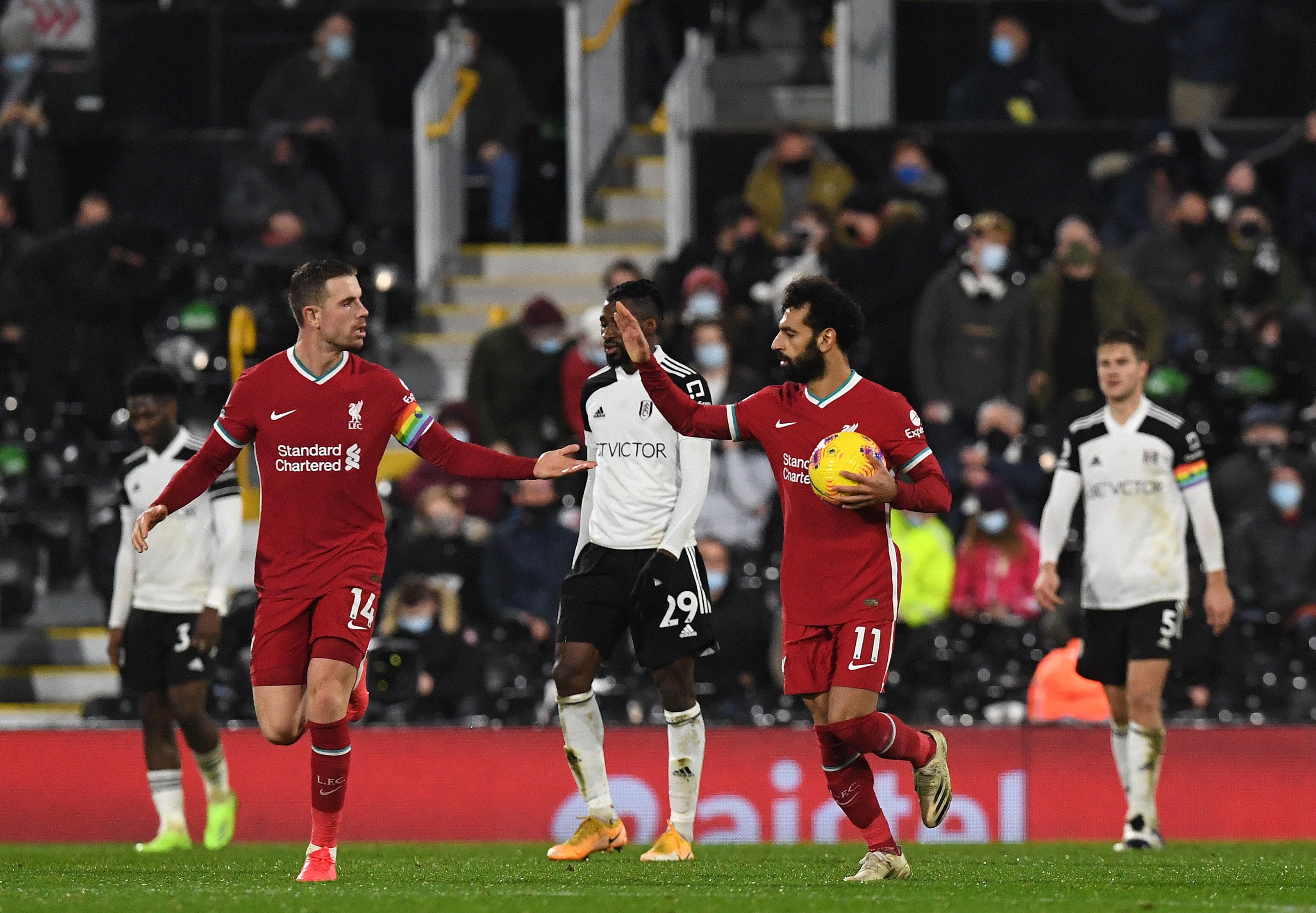 Mohamed Salah of Liverpool celebrates with Jordan Henderson