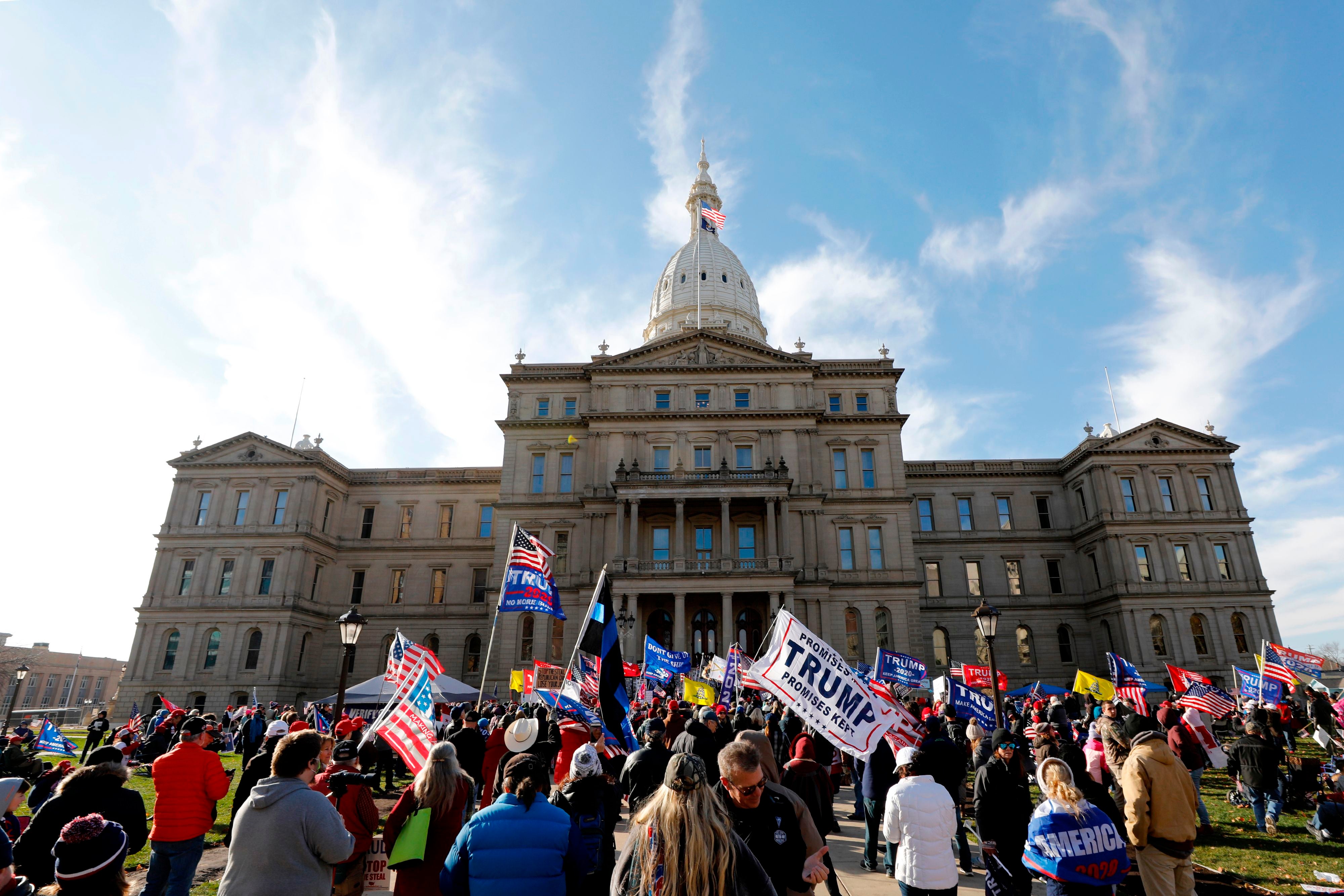 People gather at the Michigan state Capitol for a “Stop the Steal” rally in support of US President Donald Trump on 14 November, 2020