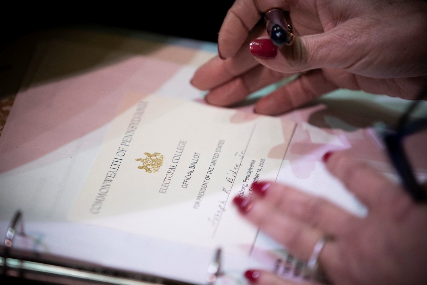 A Pennsylvania elector fills out a ballot during the state’s electoral college meeting on 14 December.