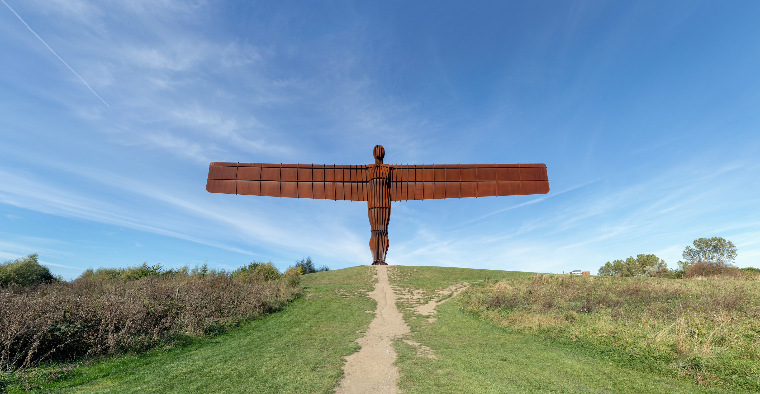 The bus driver pulled up to the bus stop at the Angel of the North and left the bus.