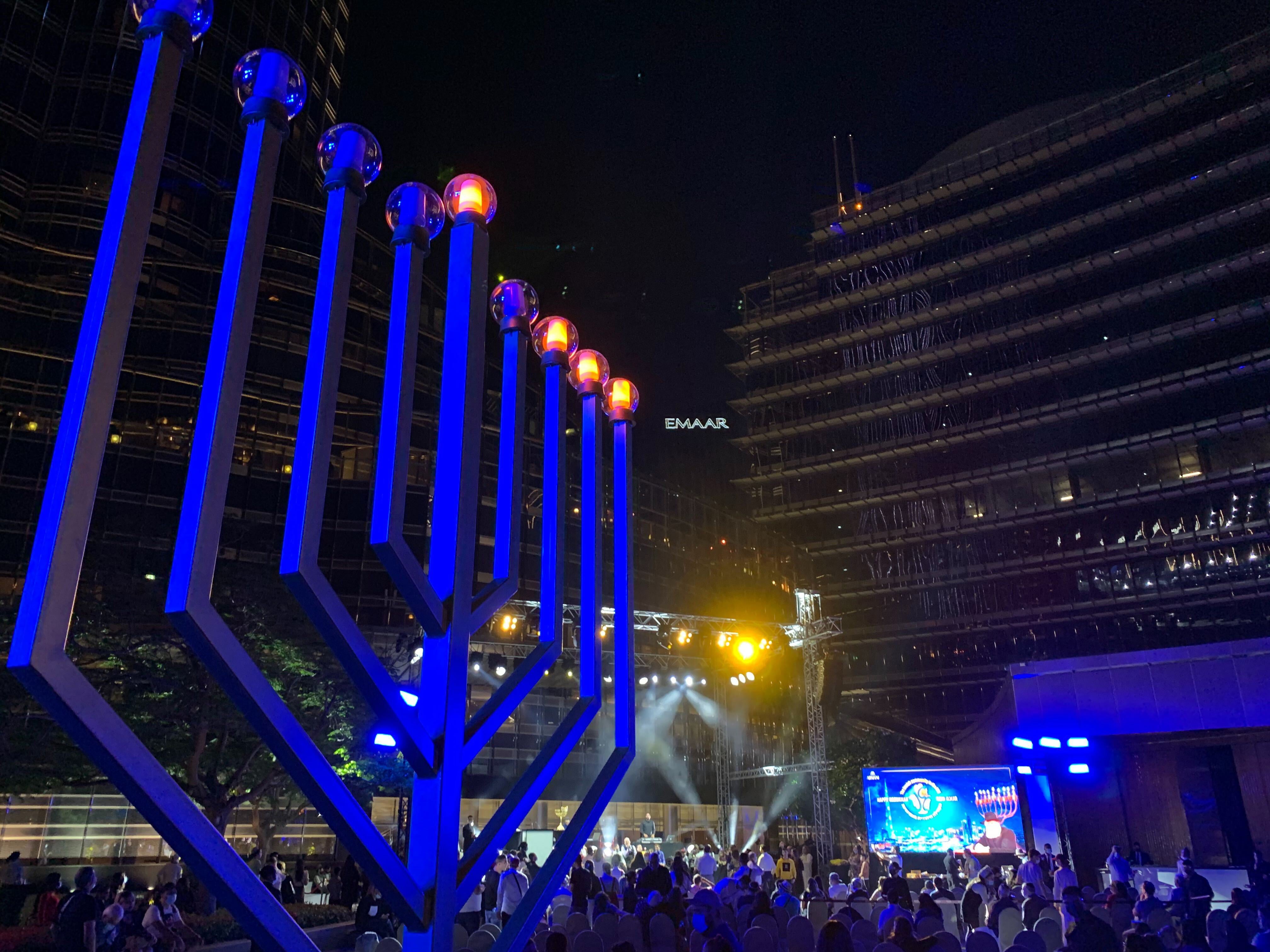 Israeli tourists in Dubai gather for the third night of Hanukkah at the base of Burj Khalifa