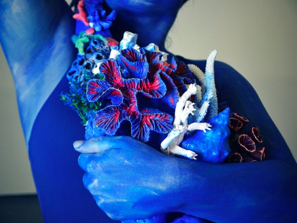 A model poses as part of the initial design of the ‘Call From The Sea’ statue by artist Laurence Payot