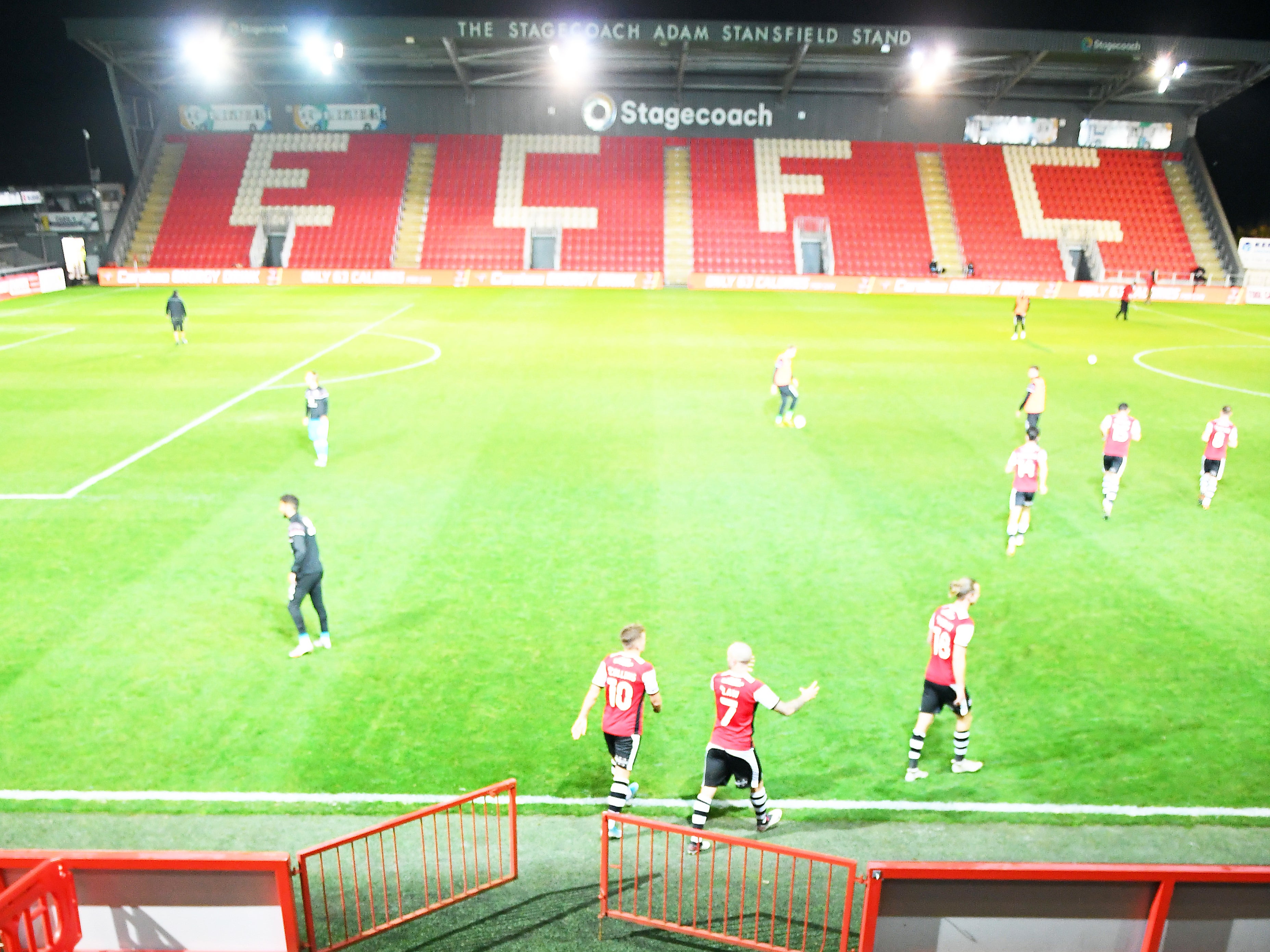 Exeter City ejected a fan who booed players taking a knee before their game against Harrogate