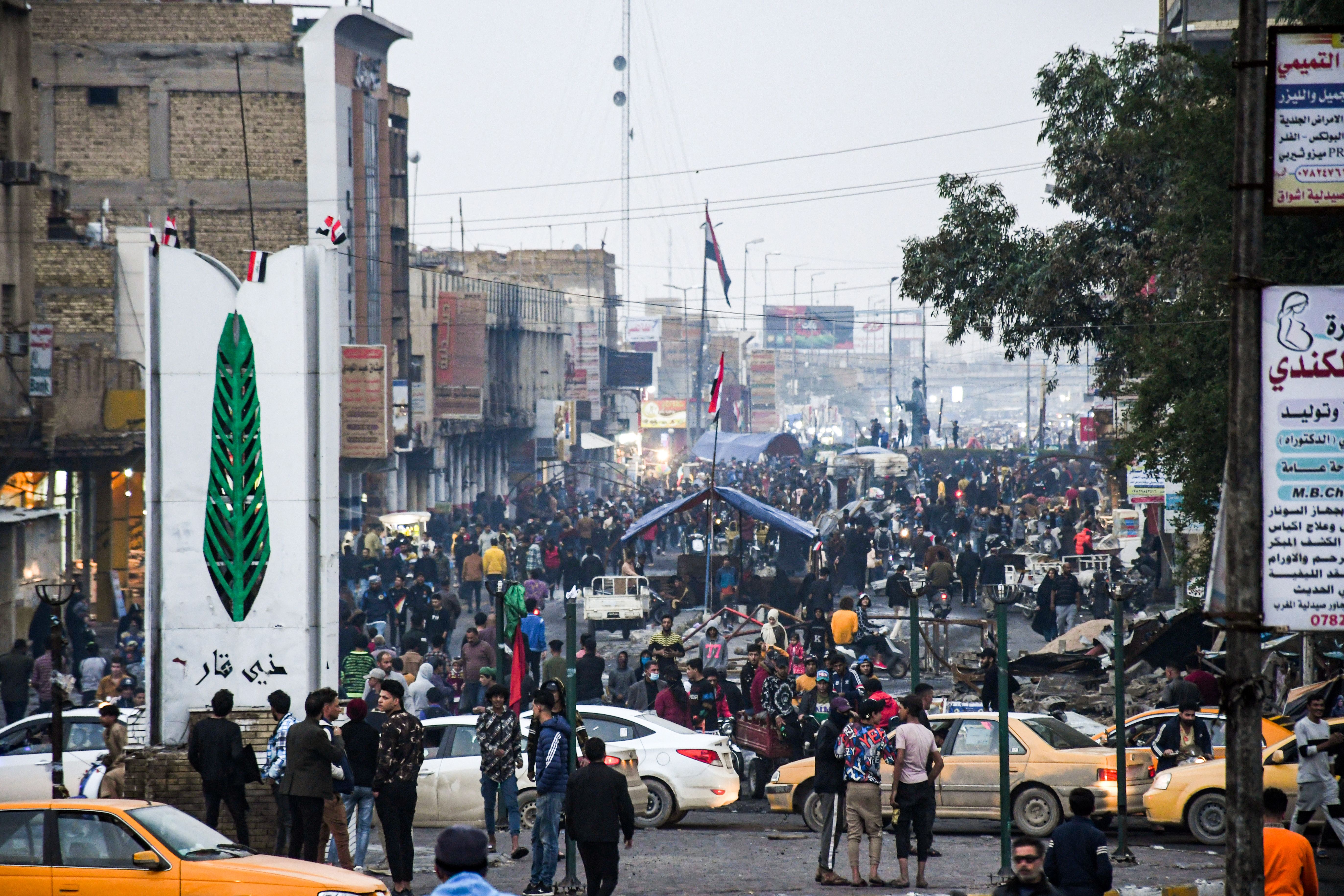 Anti-government demonstrators gather at a protest site in Habboubi Square in Iraq’s southern city of Nasiriyah in Dhi Qar province on 29 November, 2020.