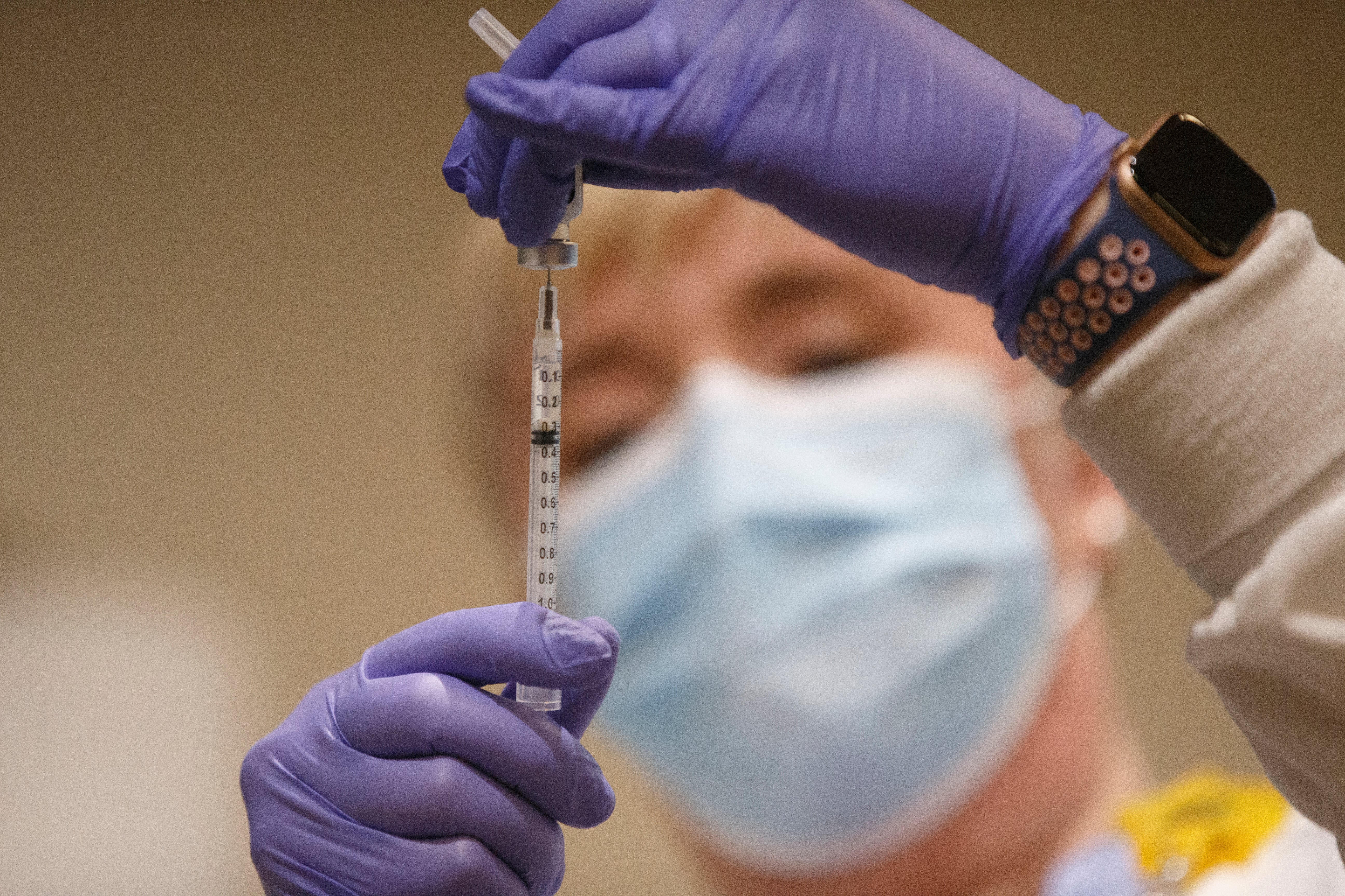 Tami Jeffries, R.N., prepares the first locally-available dose of the Pfizer-BioNTech COVID-19 vaccine at Mary Washington Hospital in Fredericksburg, Va. on Tuesday, Dec. 15, 2020.&nbsp;