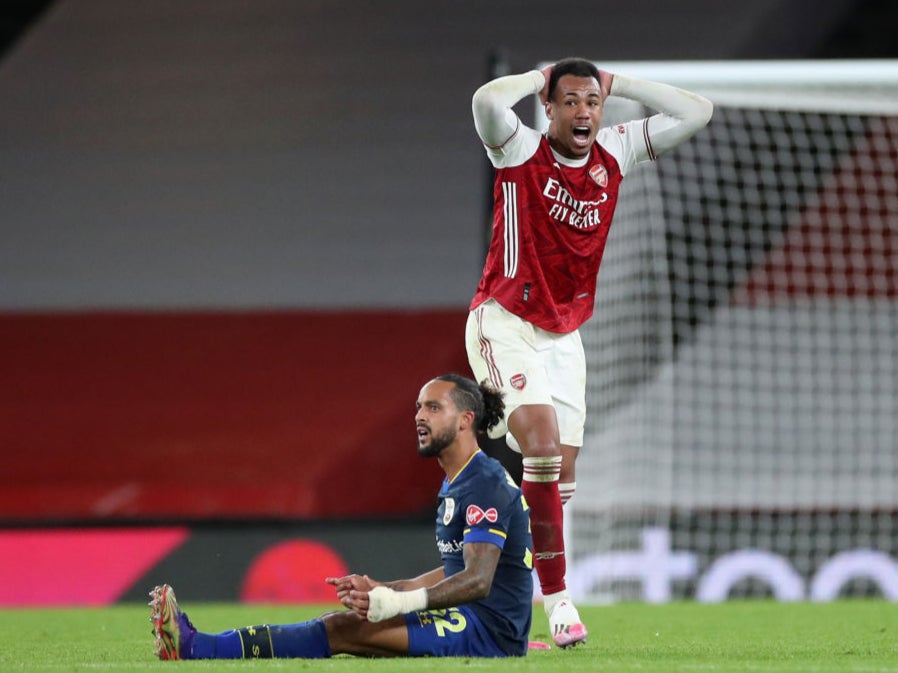 Gabriel reacts after fouling Theo Walcott to earn himself a second booking