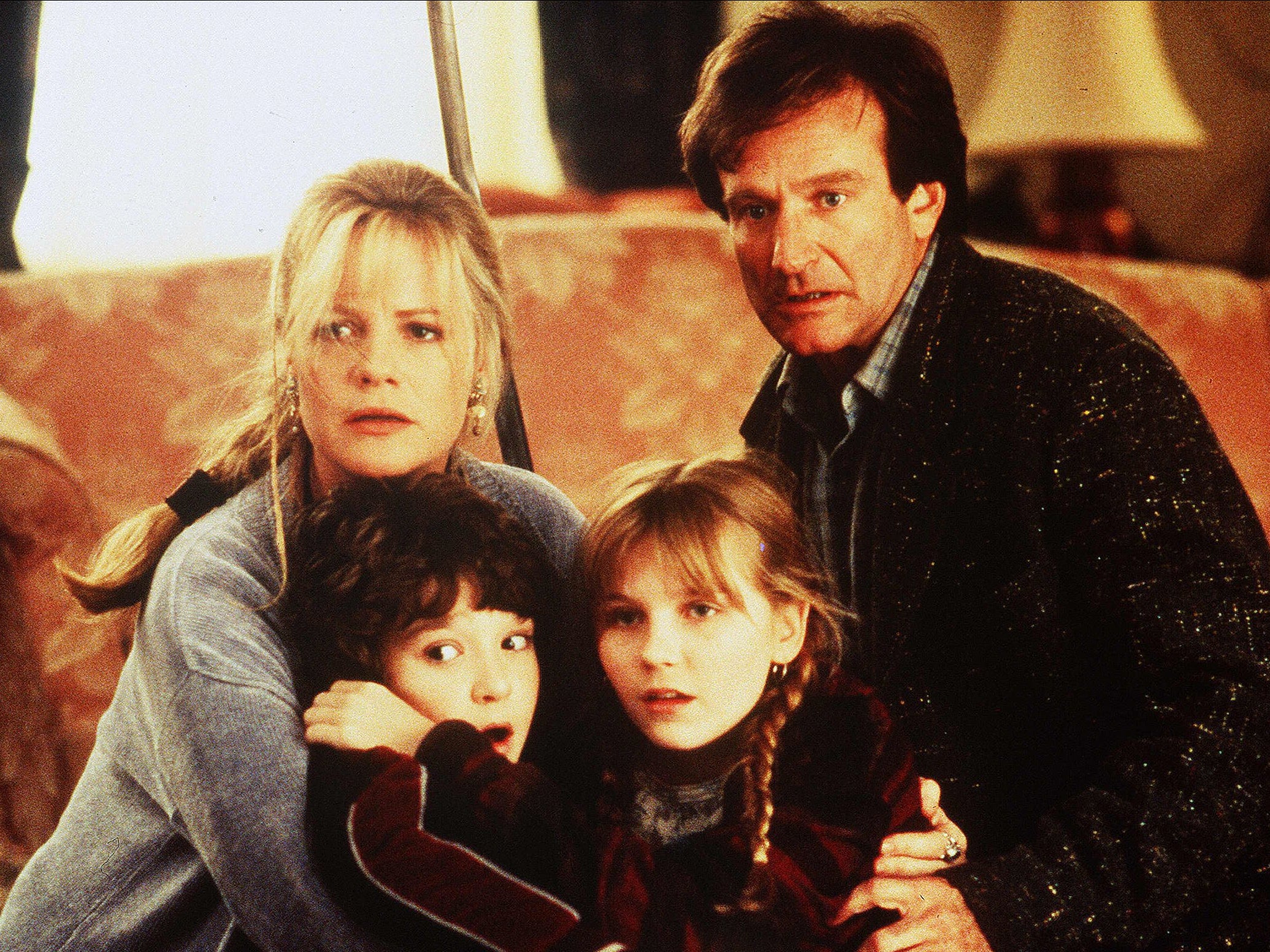 Bonnie Hunt, Bradley Pierce, Kirsten Dunst and Robin Williams in ‘Jumanji’