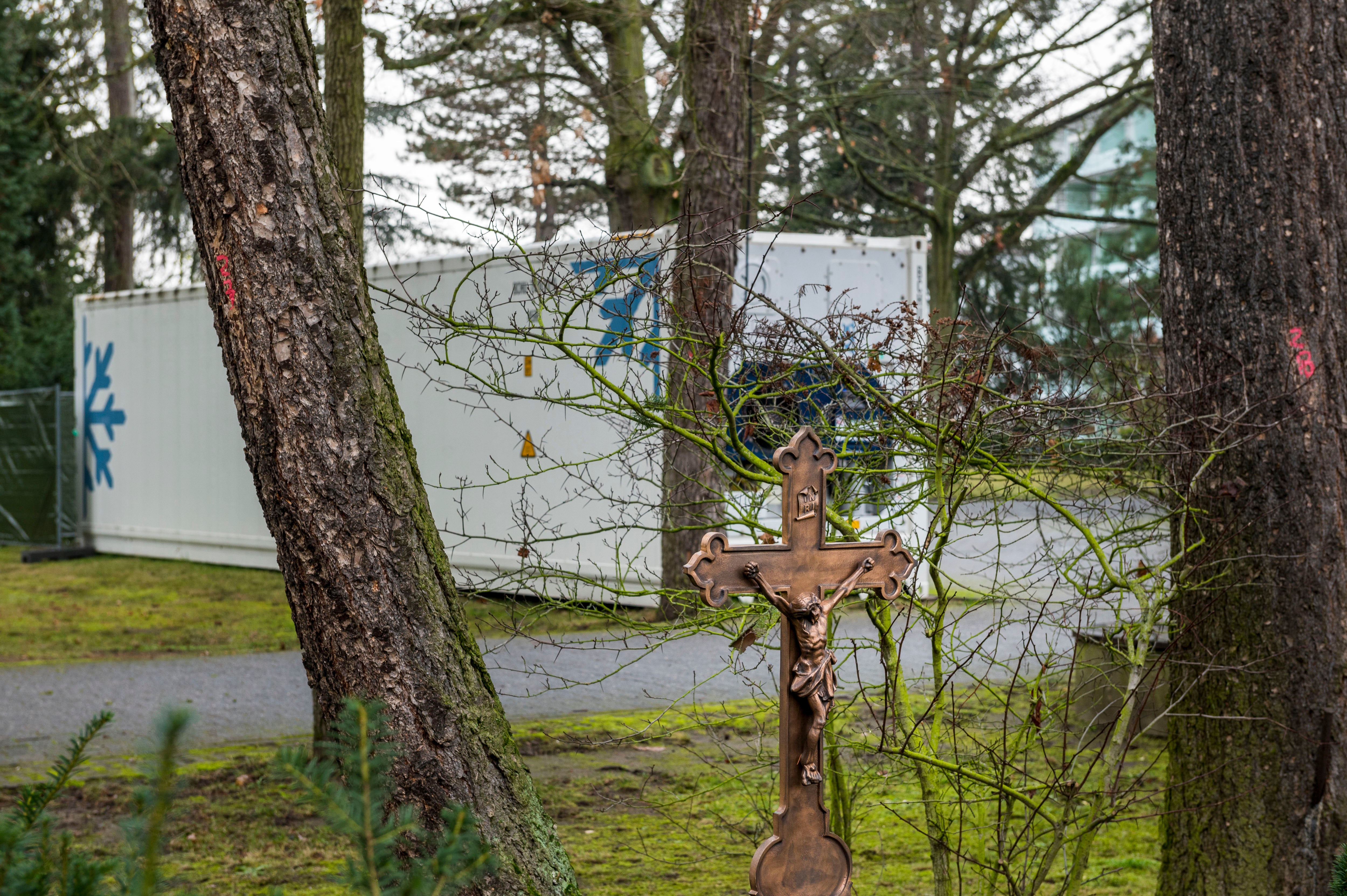 A cooling container for storing dead bodies stands at the city cemetery during the second wave of the coronavirus pandemic on 17 December 2020 in Hanau, Germany.