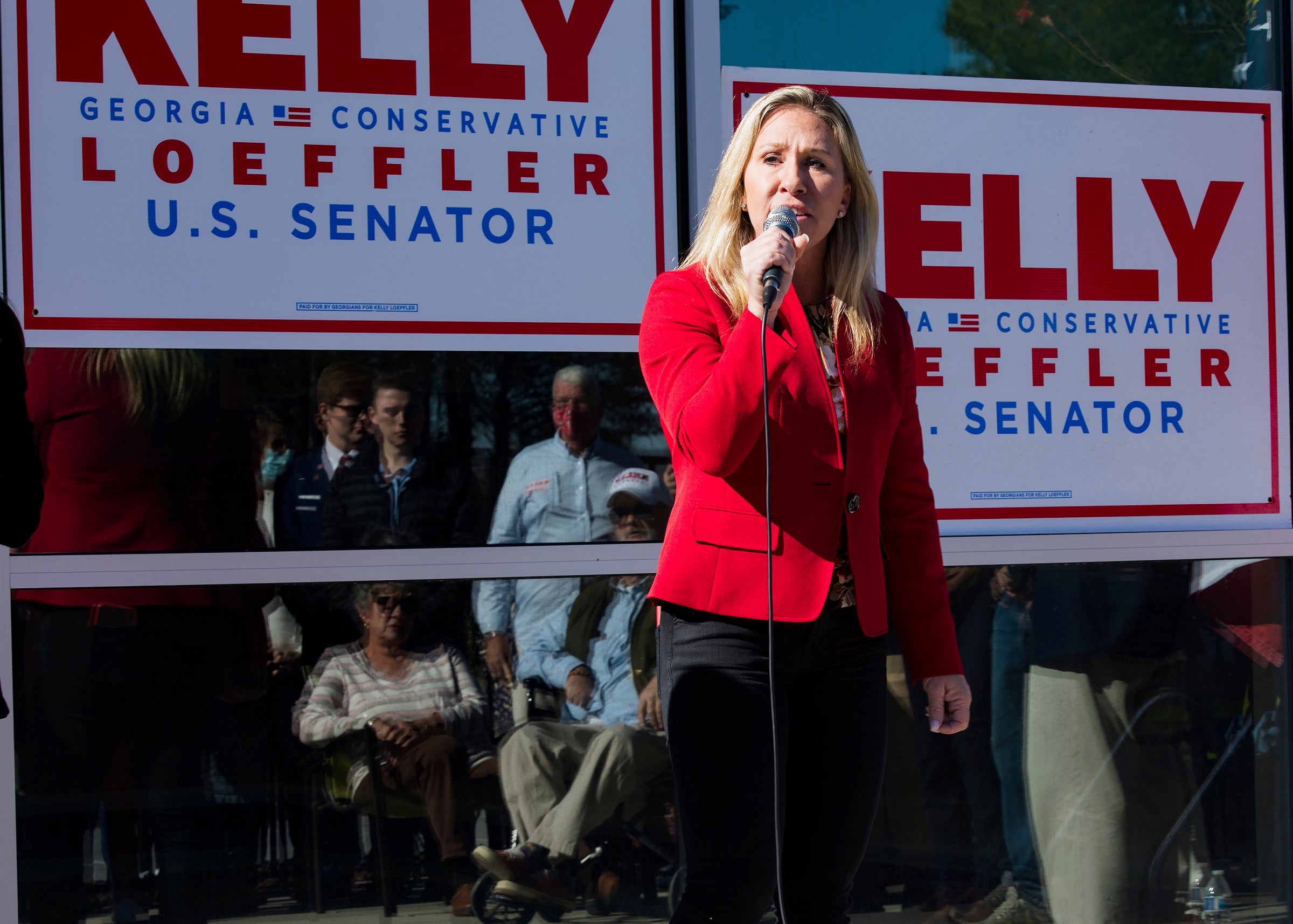 Incoming congresswoman Marjorie Taylor Green, campaigning for Georgia Senator Kelly Loeffler in Georgia on 18 December, says she will reject electoral college votes for Joe Biden.