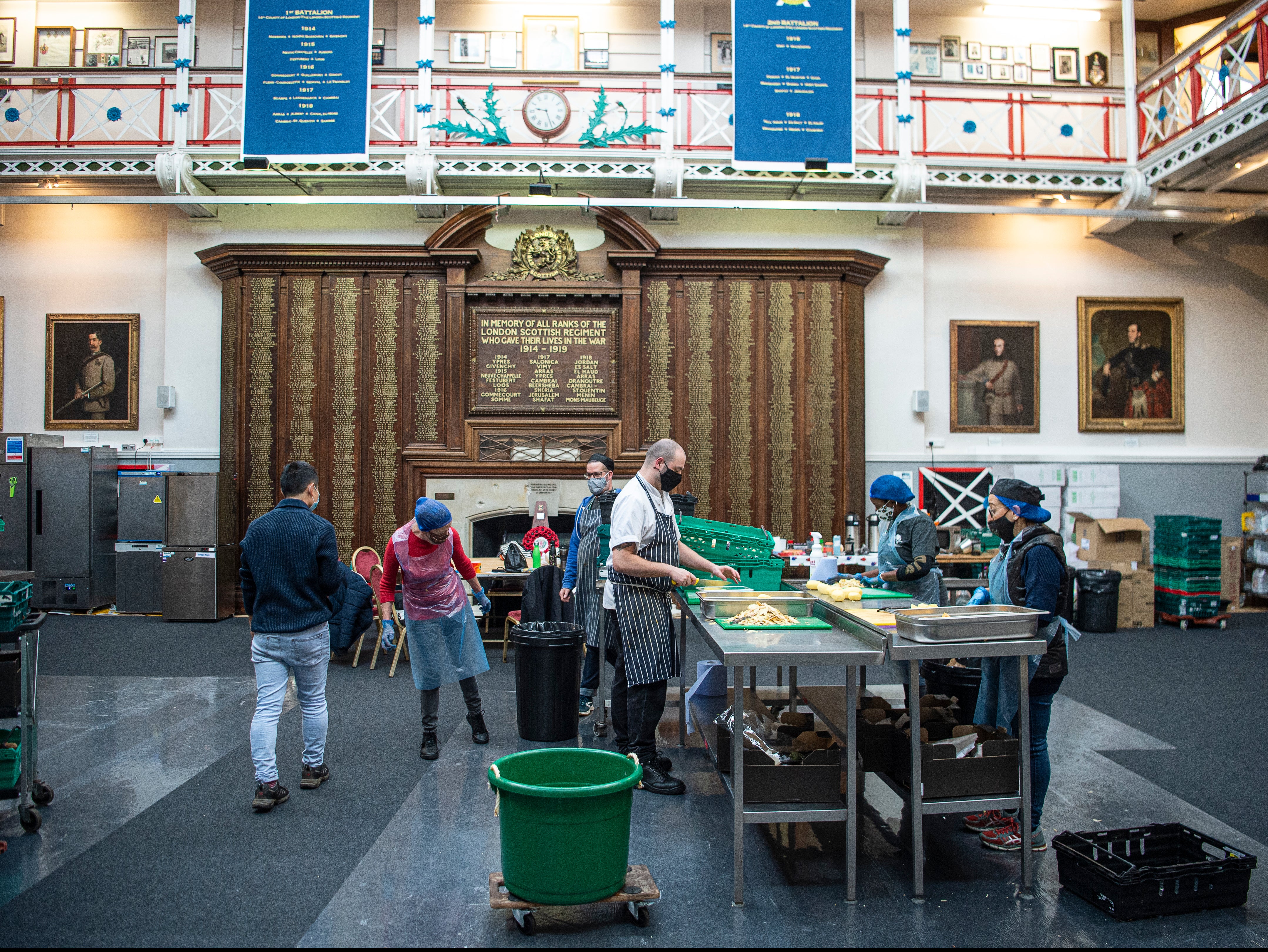 With Compassion volunteers chop vegetables to supply the kitchen at London Scottish House