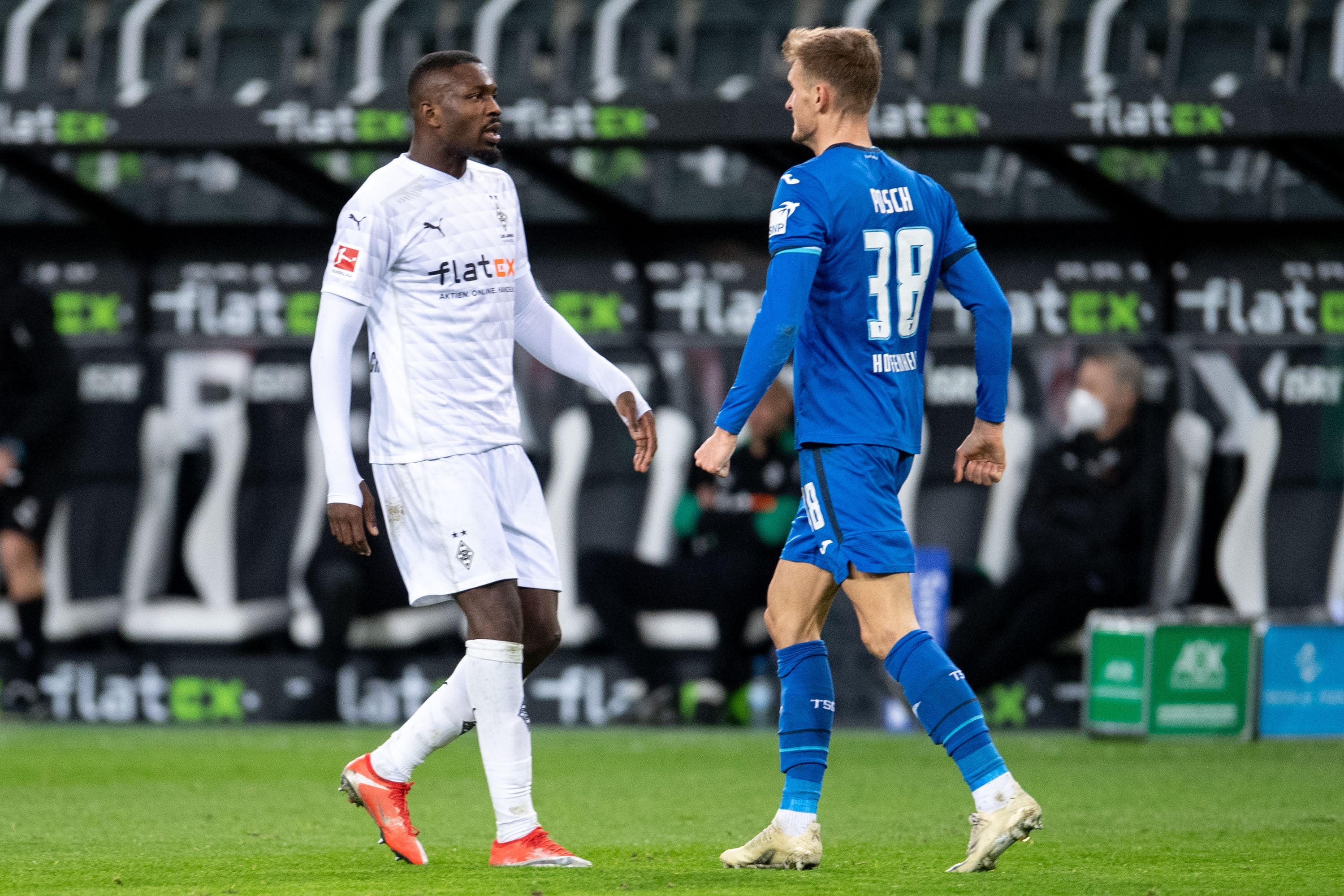 Gladbach’s Marcus Thuram and Hoffenheim’s Stefan Posch clash