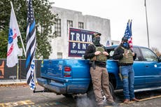 Armed protesters surround Oregon meeting on Covid lockdown