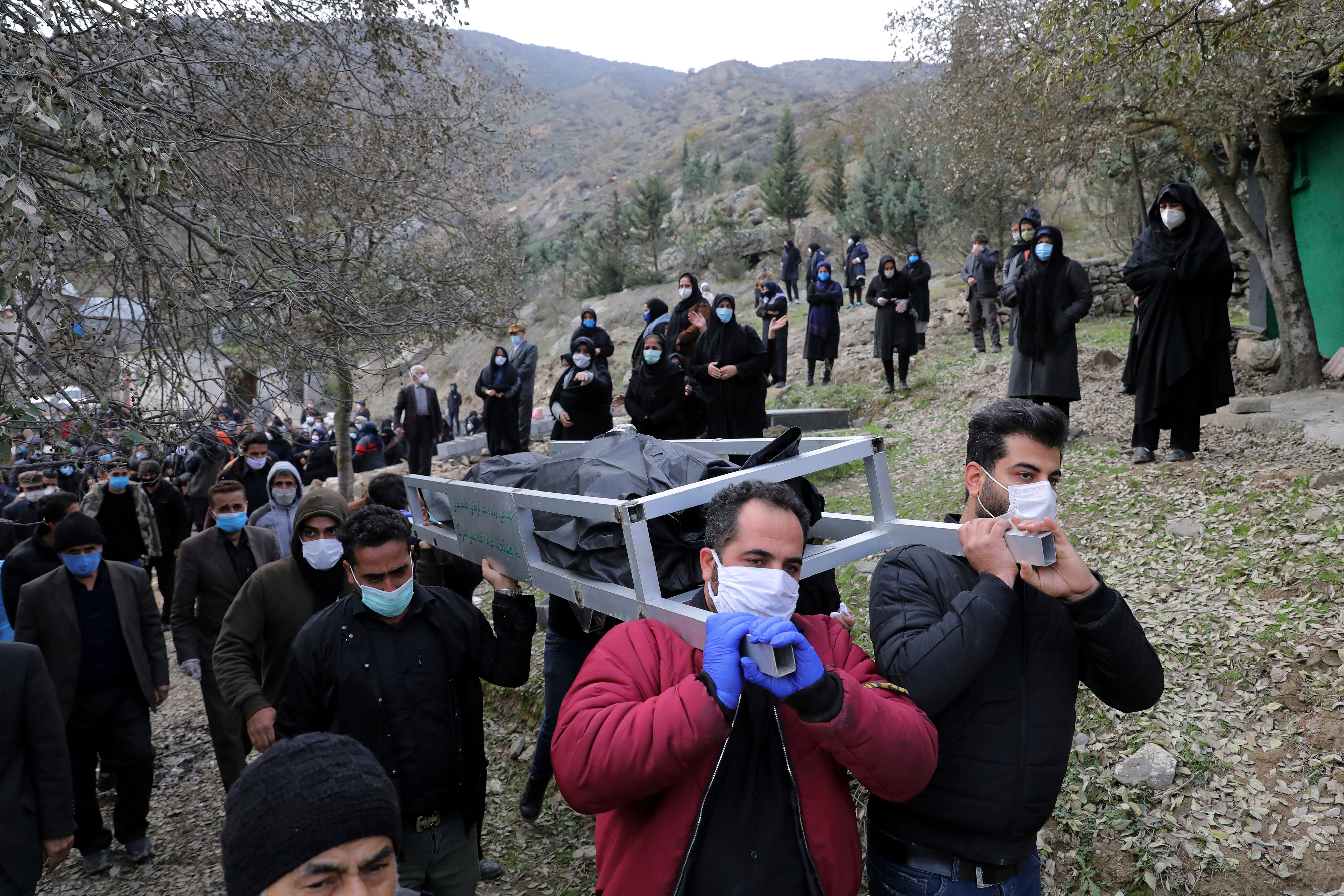 Virus Outbreak Iran Burials Photo Gallery