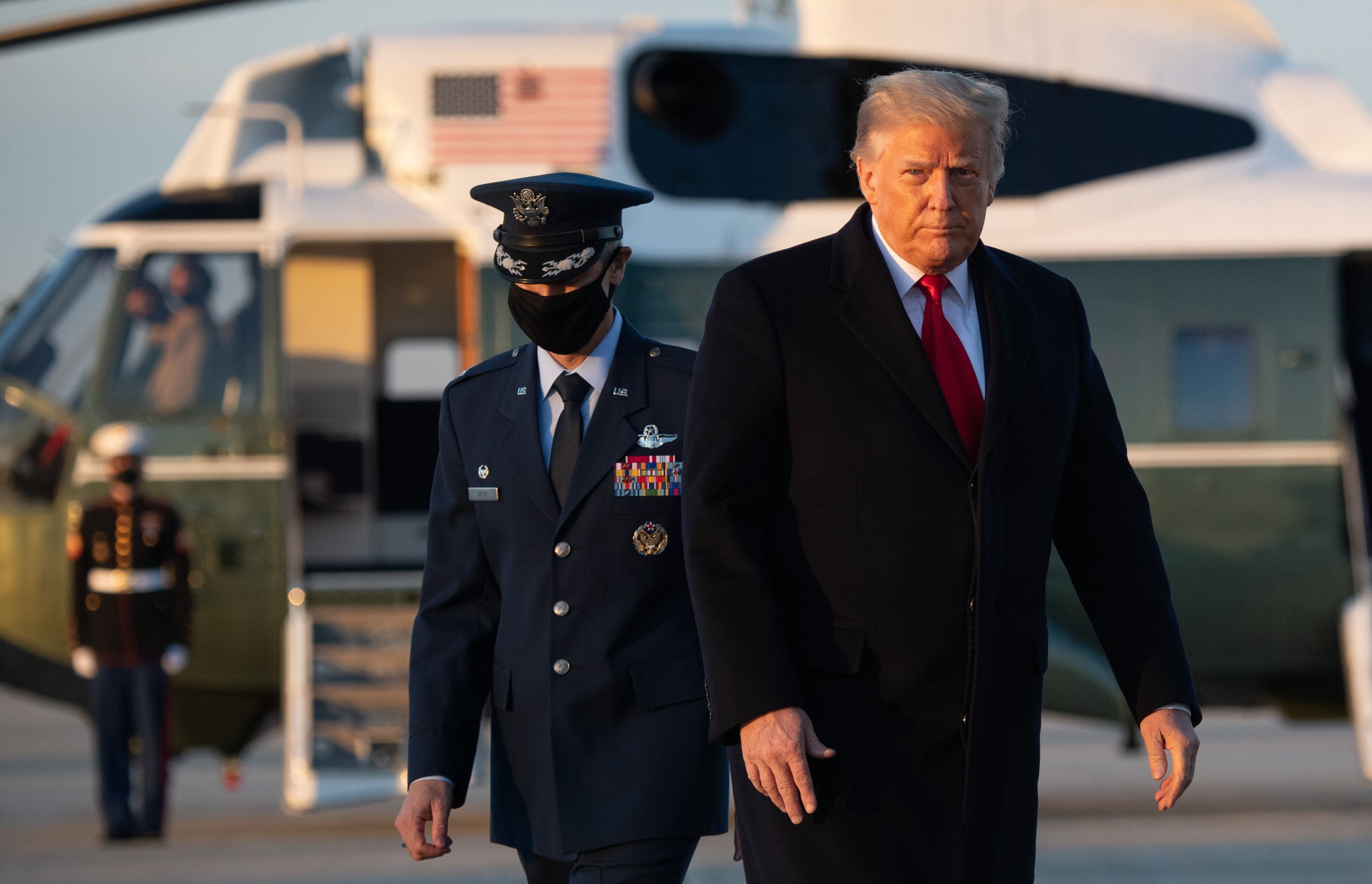 US President Donald Trump walks to board Air Force One prior to departure from Joint Base Andrews in Maryland, December 23, 2020, as they travel to Mar-a-lago for Christmas and New Year's. (Photo by SAUL LOEB / AFP)