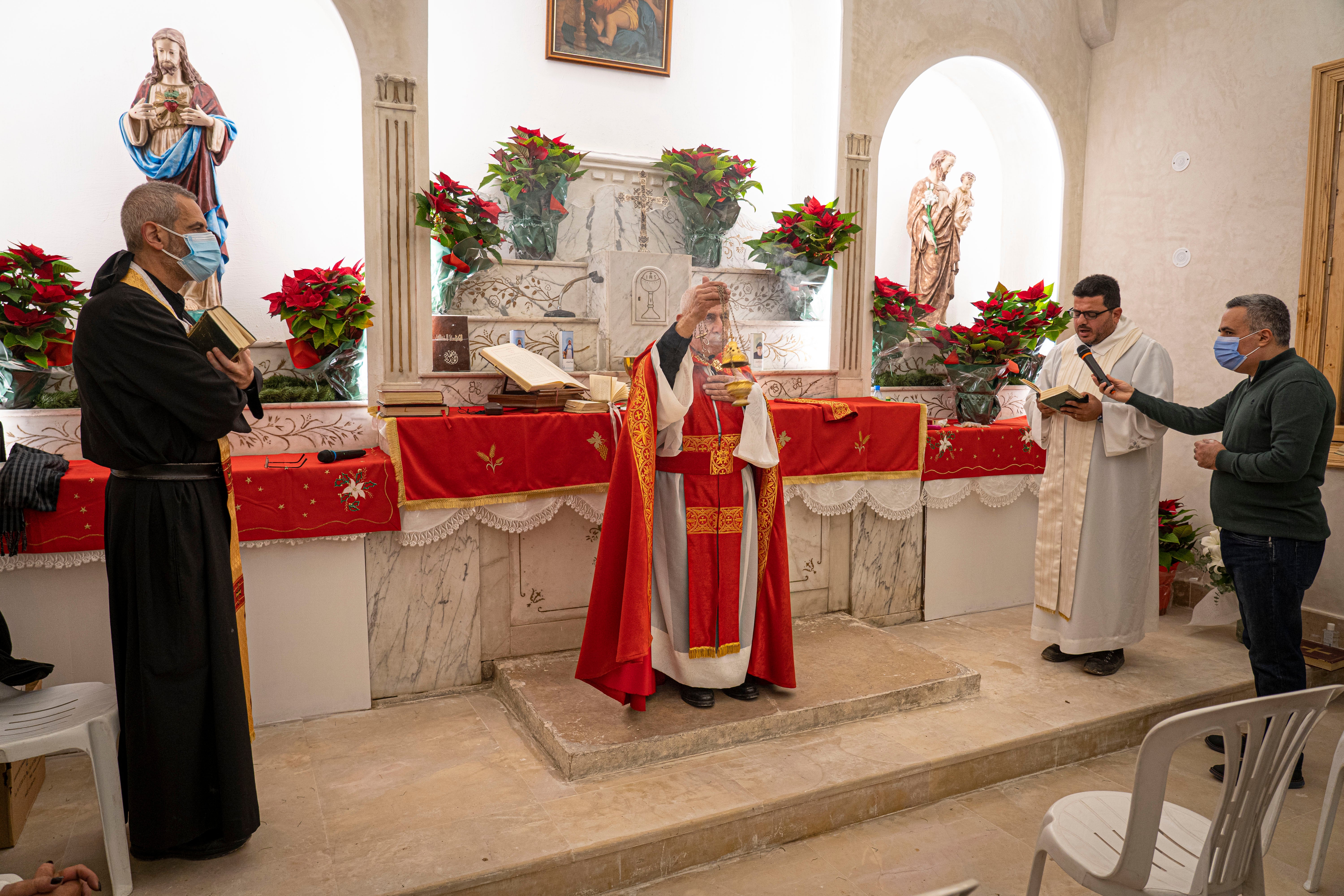 Lebanese Christians celebrate Christmas Eve mass in a recently rebuilt church that was destroyed in the Beirut blast