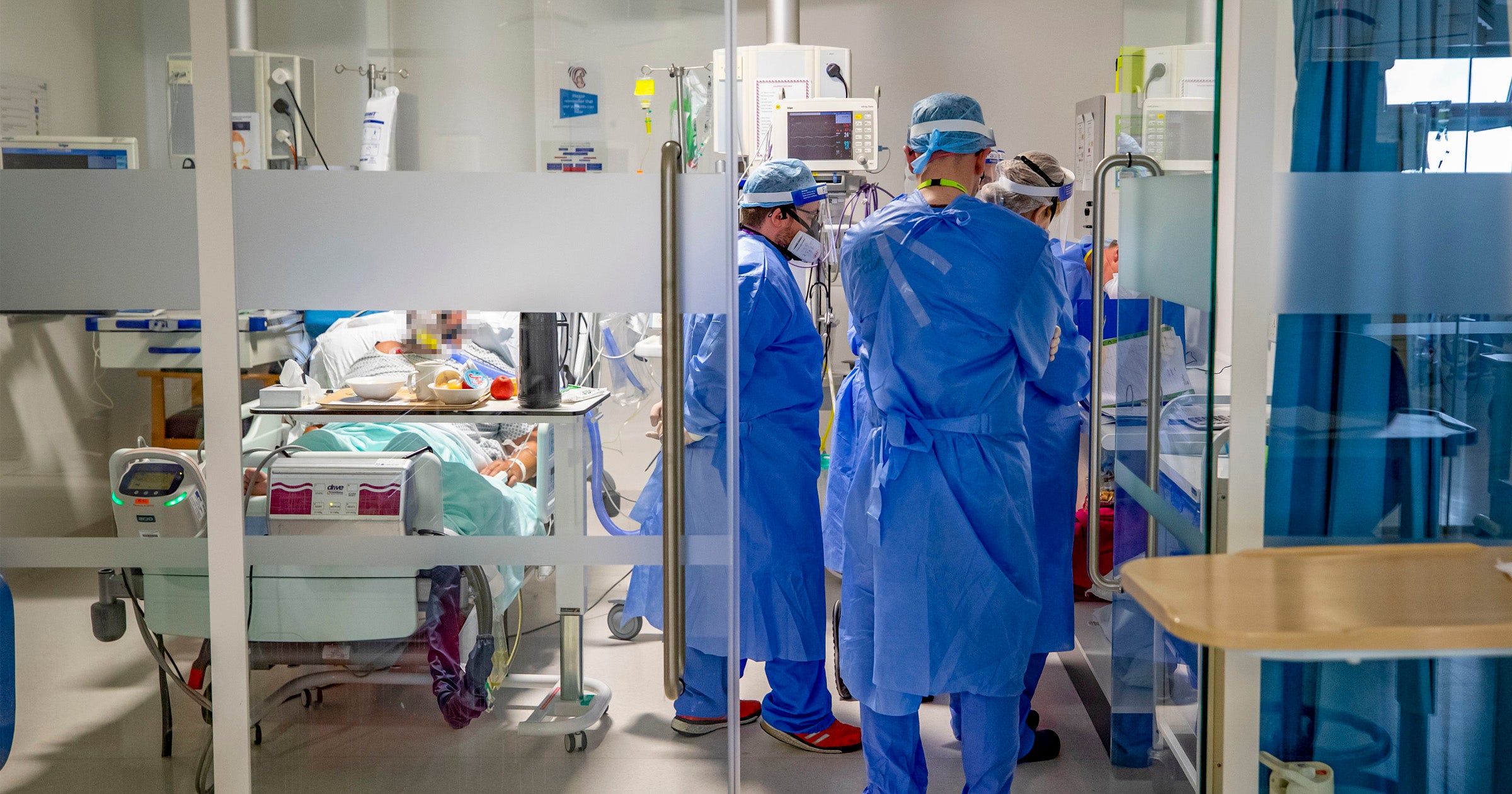 Doctors treating patients on the intensive care unit (ICU) at Whiston Hospital in Merseyside