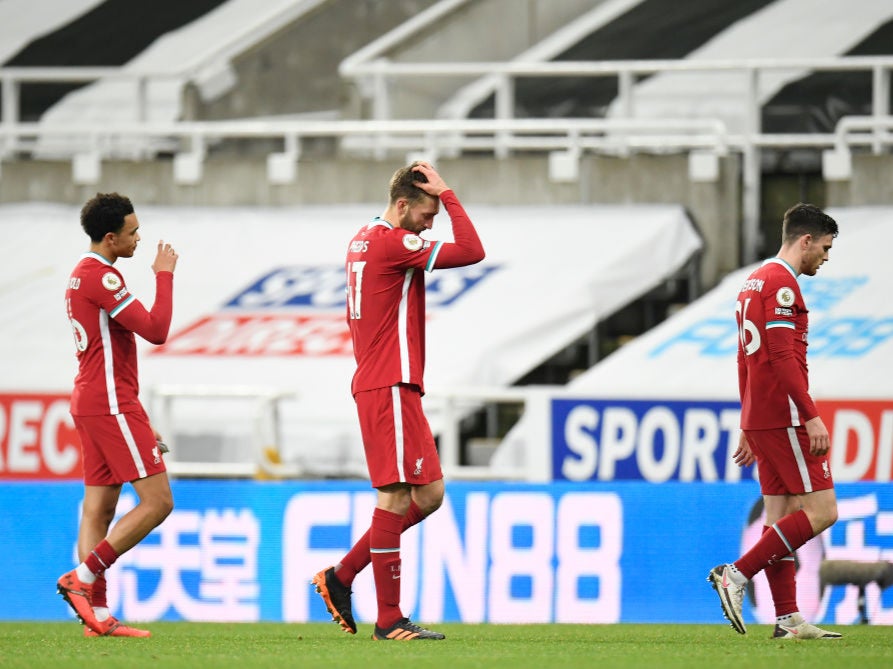 Andrew Robertson, Nathaniel Phillips and Trent Alexander-Arnold appear dejected after drawing at Newcastle