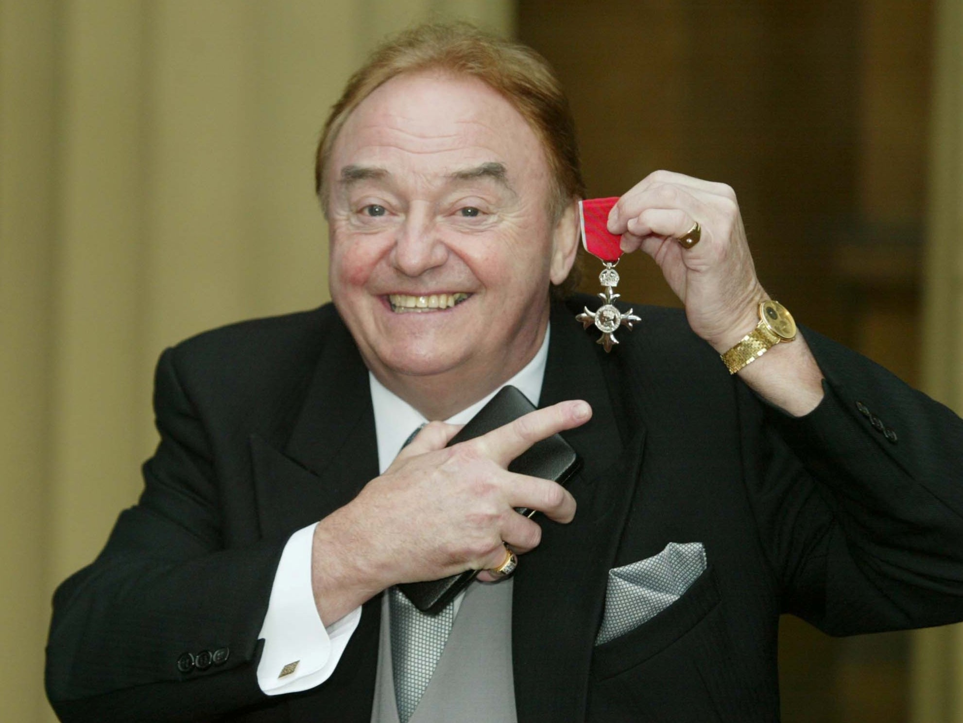 Marsden with his MBE for services to charity at Buckingham Palace in December 2003. He helped raise more than £35m for good causes