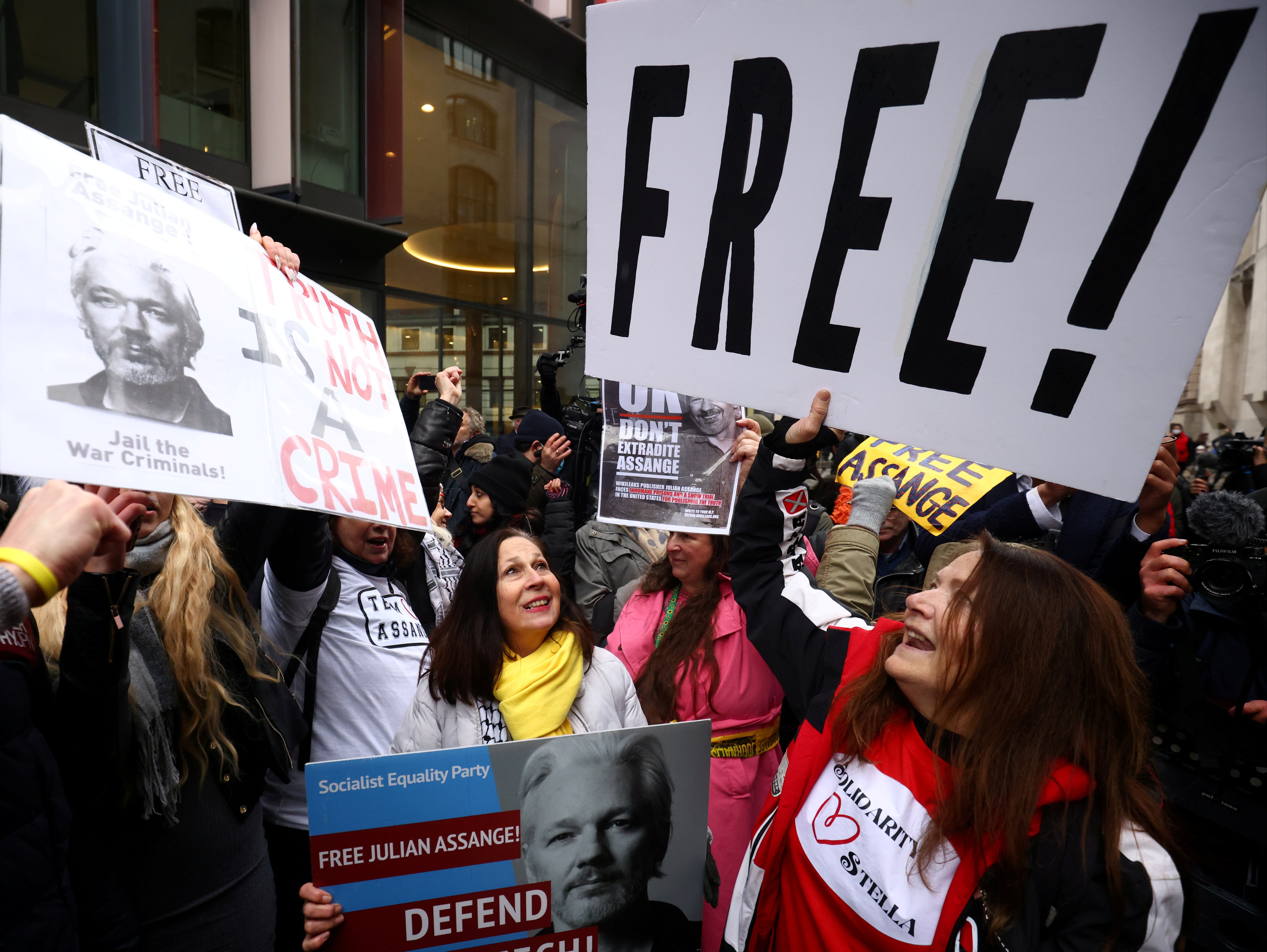 Supporters celebrate outside court