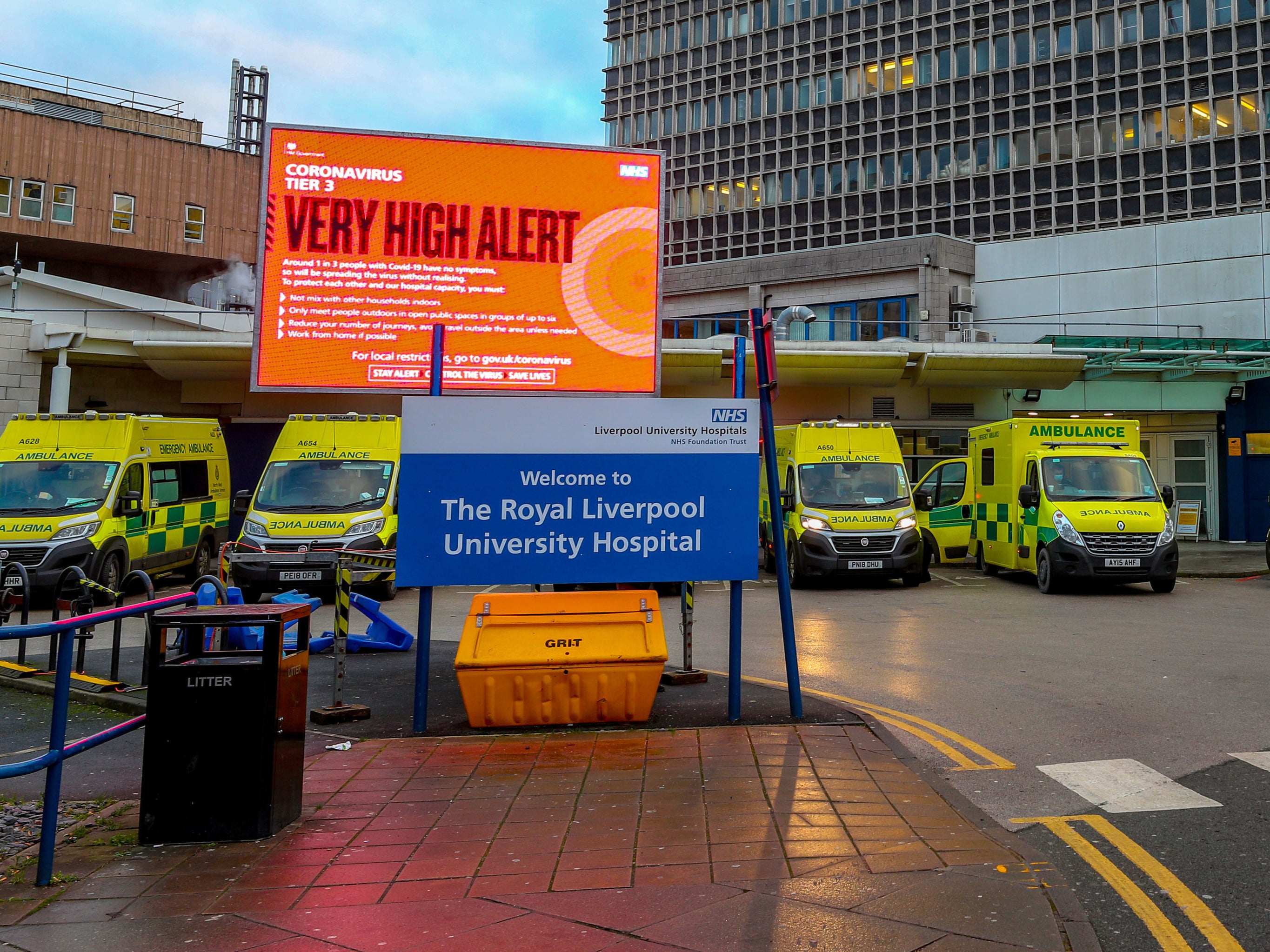 Ambulance bays outside the Royal Liverpool Hospital, where there is an electronic notice board showing the coronavirus tier level