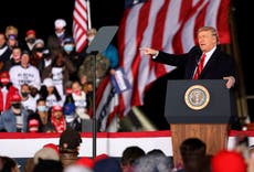 Trump brings election conspiracies to Georgia on eve of Senate runoff