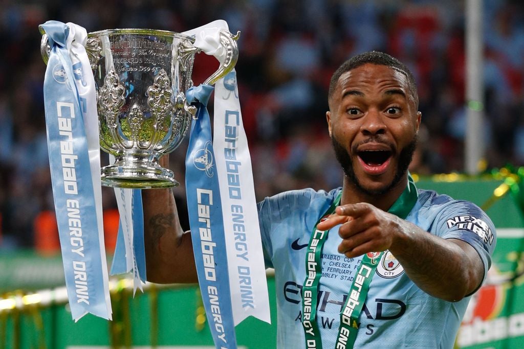 Raheem Sterling with the Carabao Cup trophy