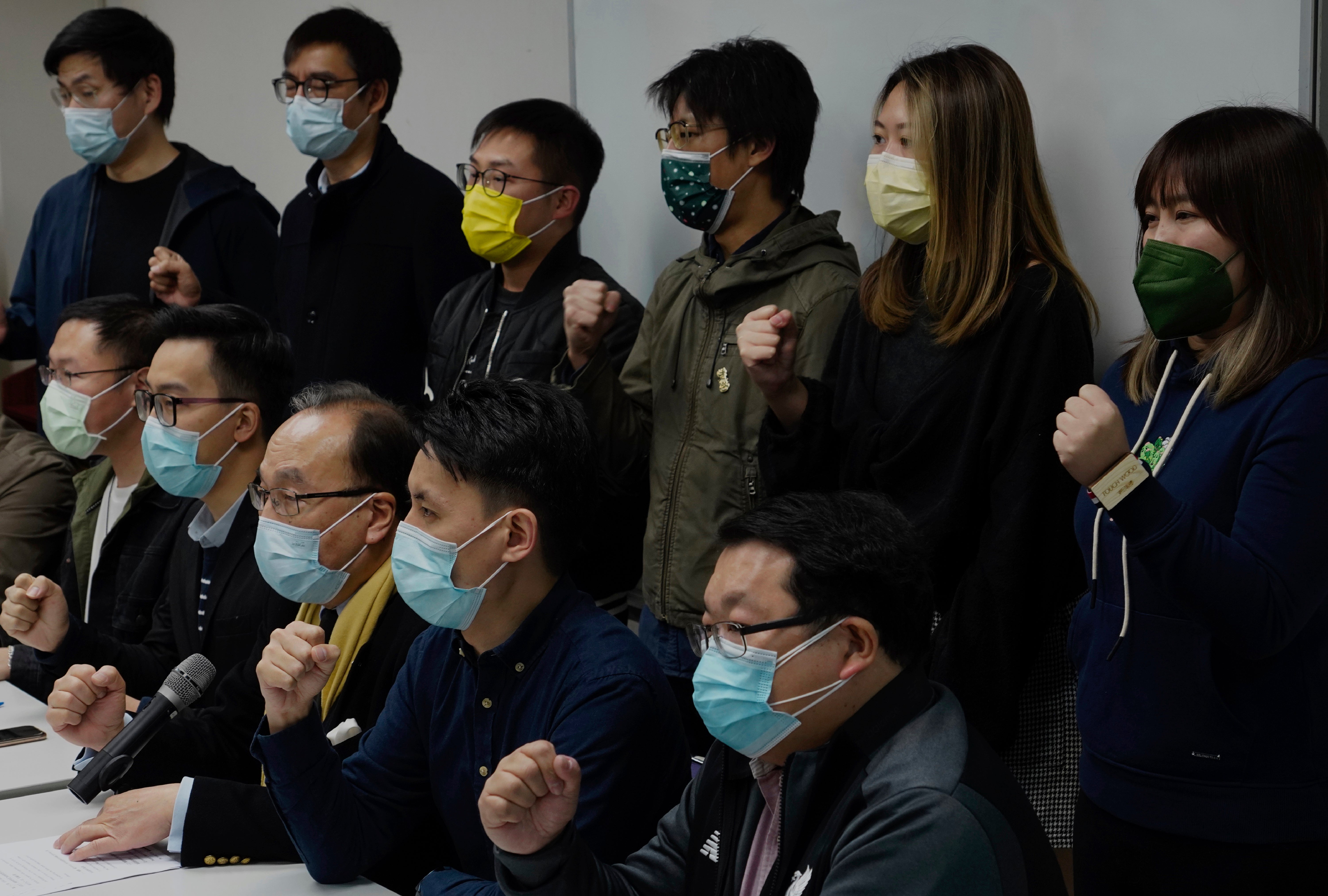 Pro-democratic party members shout slogans in response to the mass arrests (AP Photo/Vincent Yu)