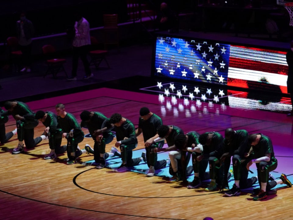 NBA plays on with a ‘heavy heart’ after Capitol riots as players and coaches kneel for national anthem